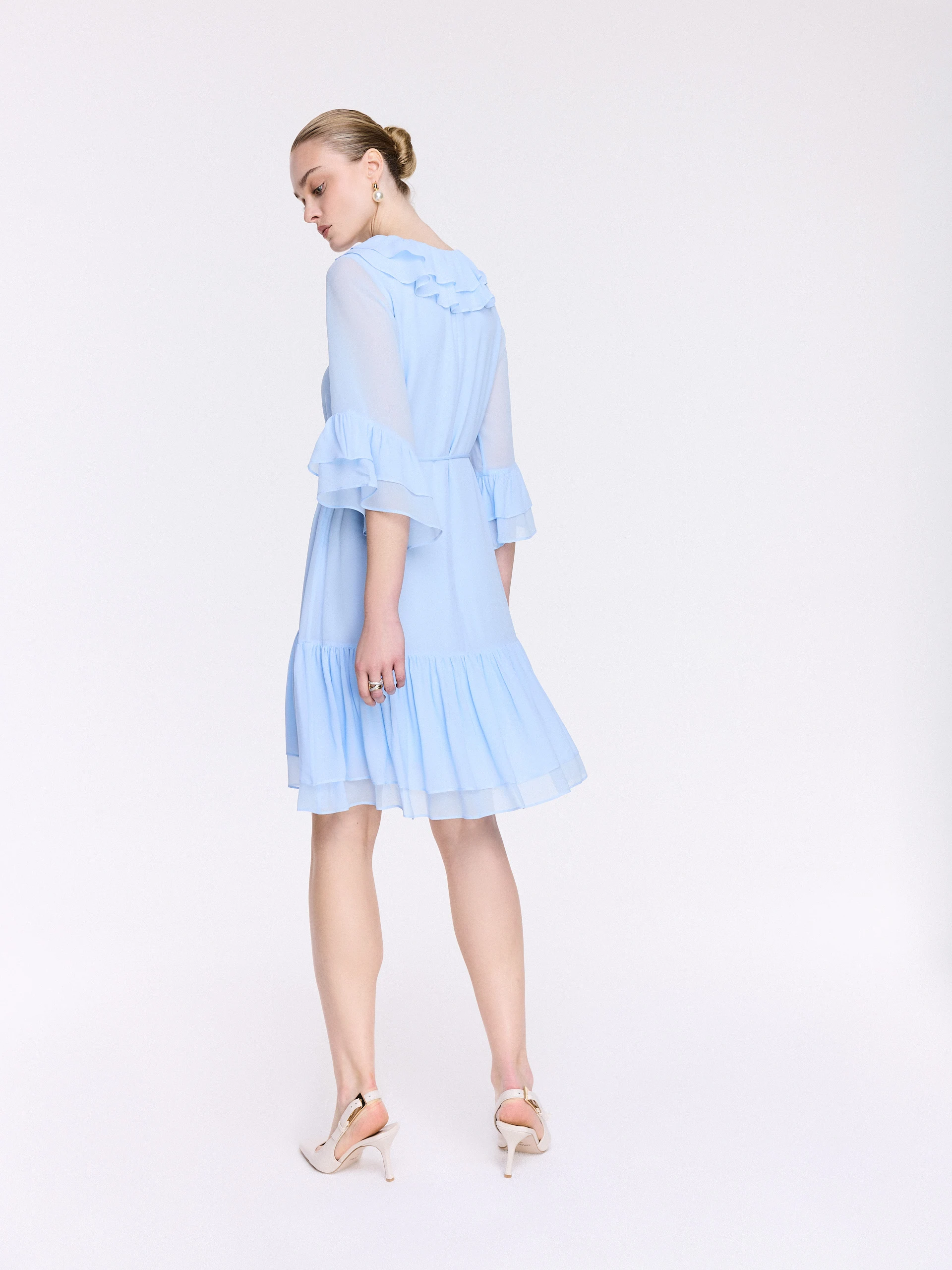A short blue dress with ruffles