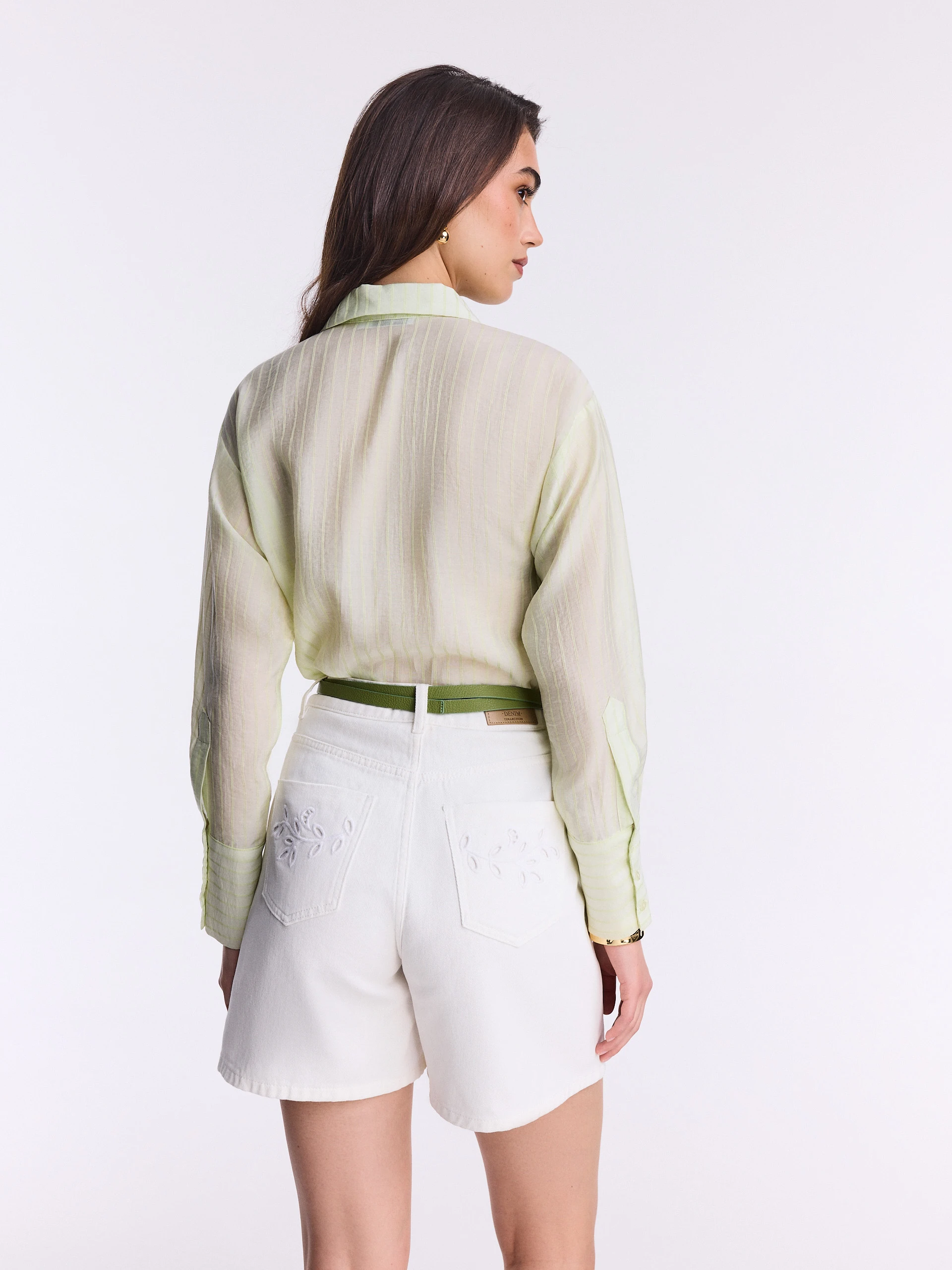Short white denim pants with openwork decoration