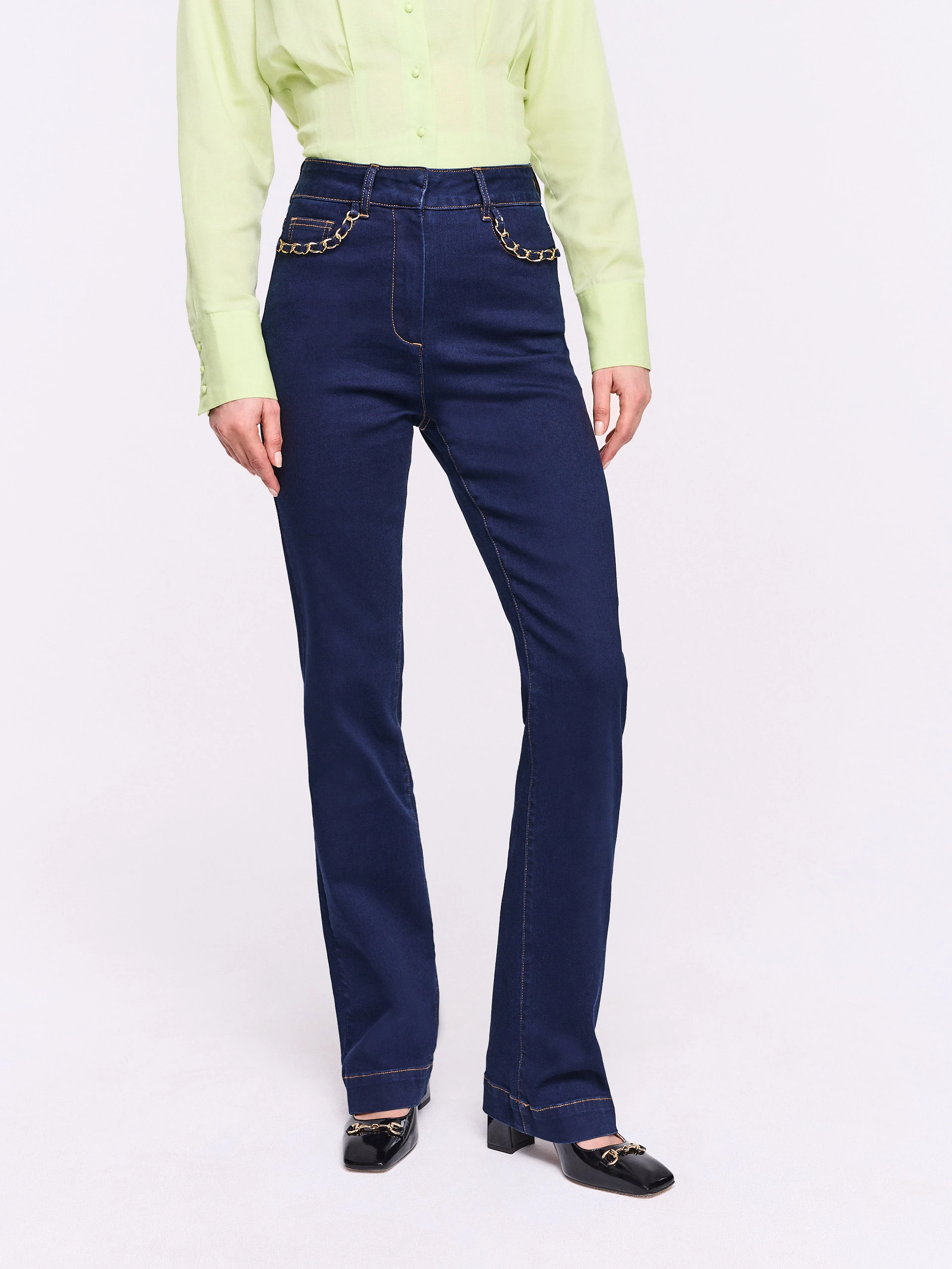 Navy blue straight jeans with decorative pockets