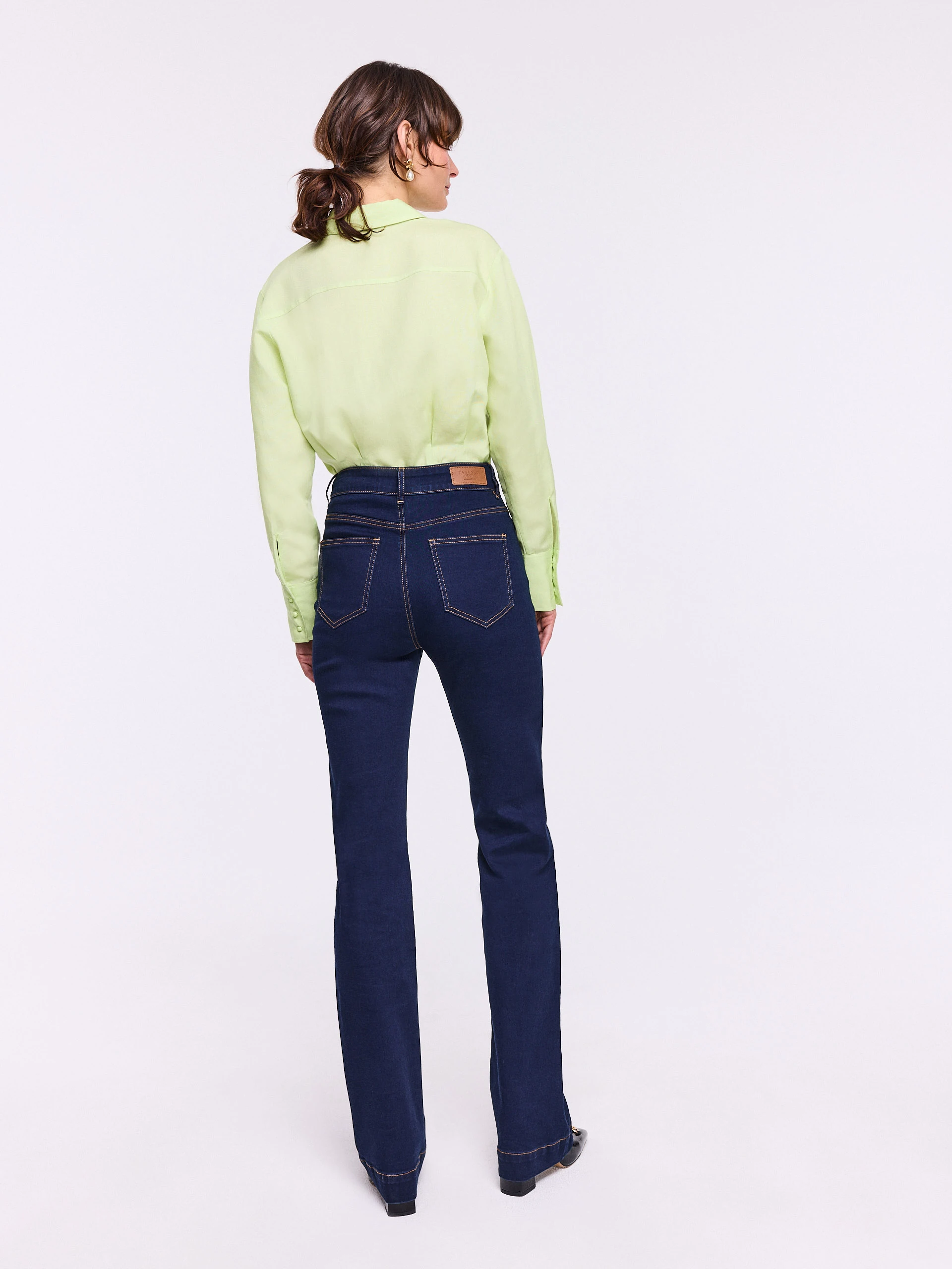 Navy blue straight jeans with decorative pockets