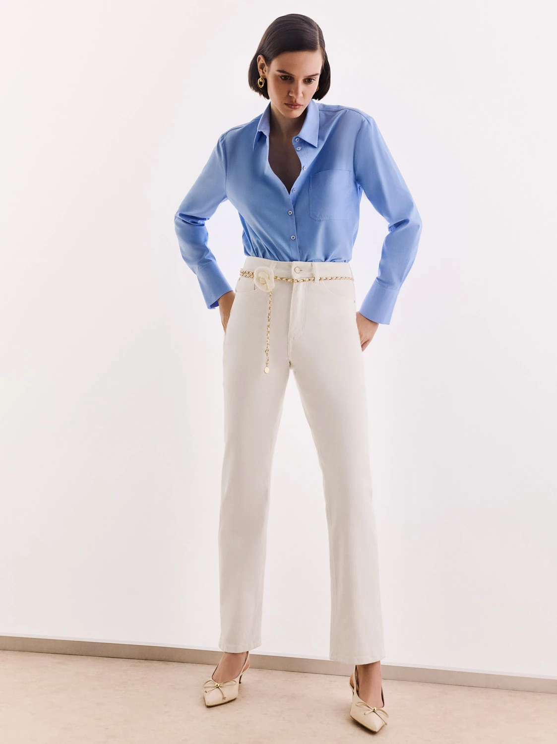 Simple cream jeans with a decorative belt