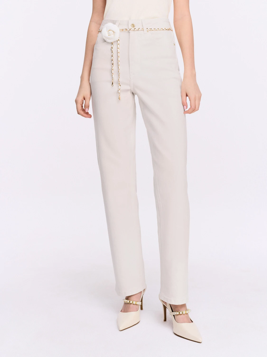 Simple cream jeans with a decorative belt