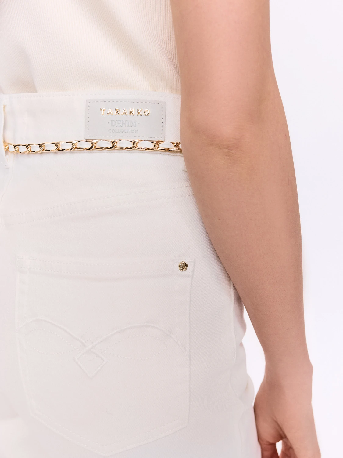 Simple cream jeans with a decorative belt