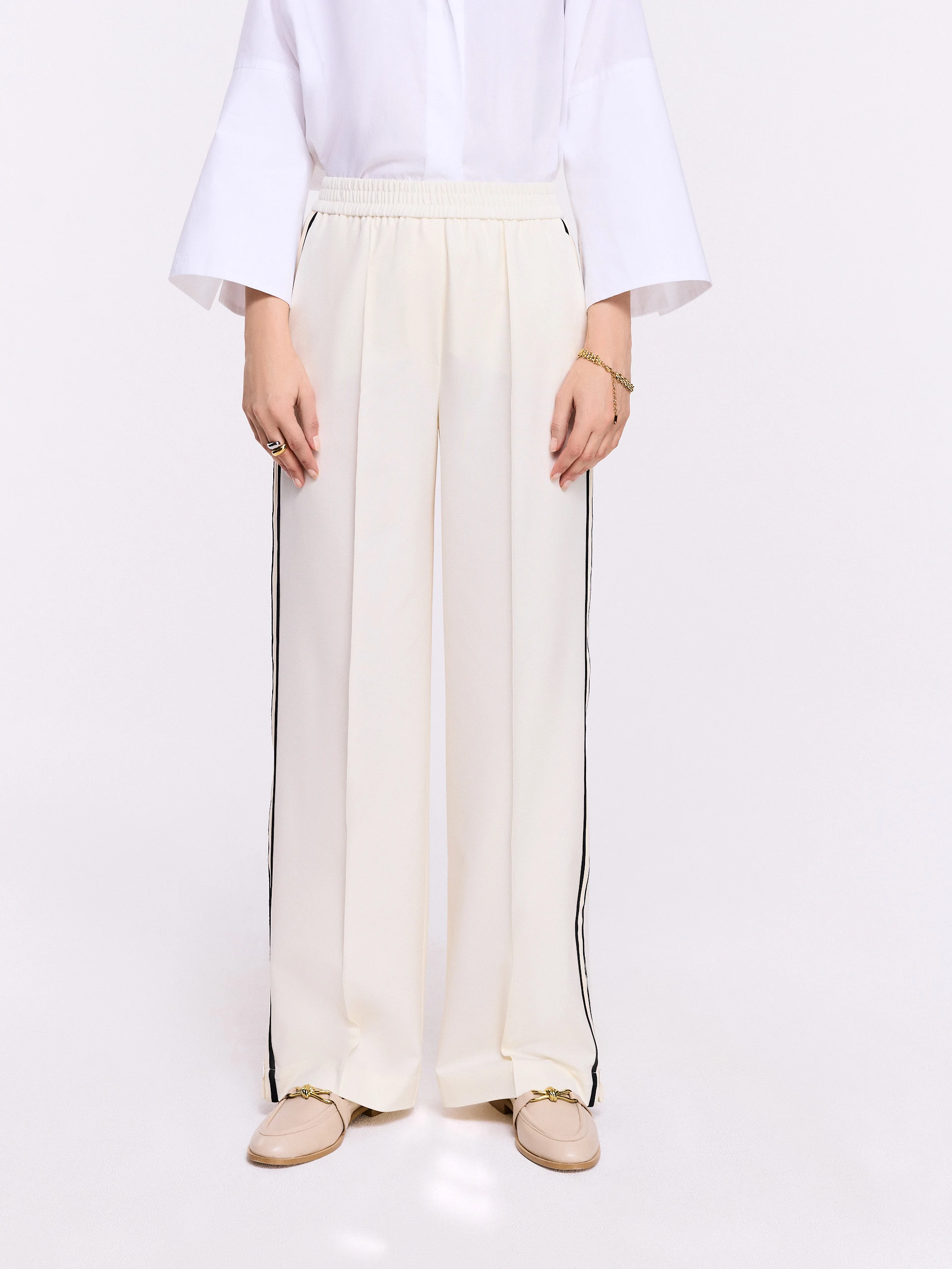 Cream pants with black piping