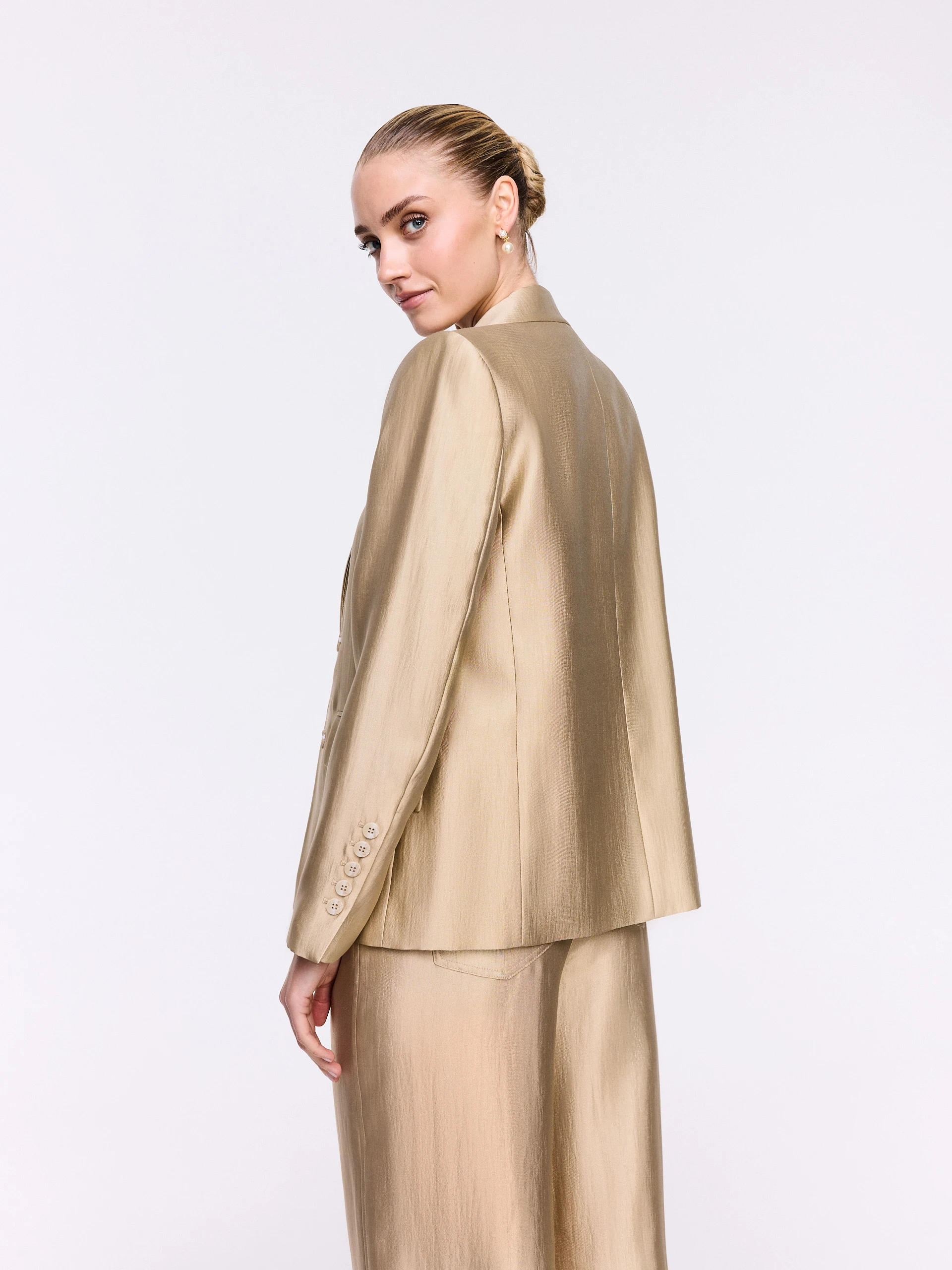 A gold-toned blazer