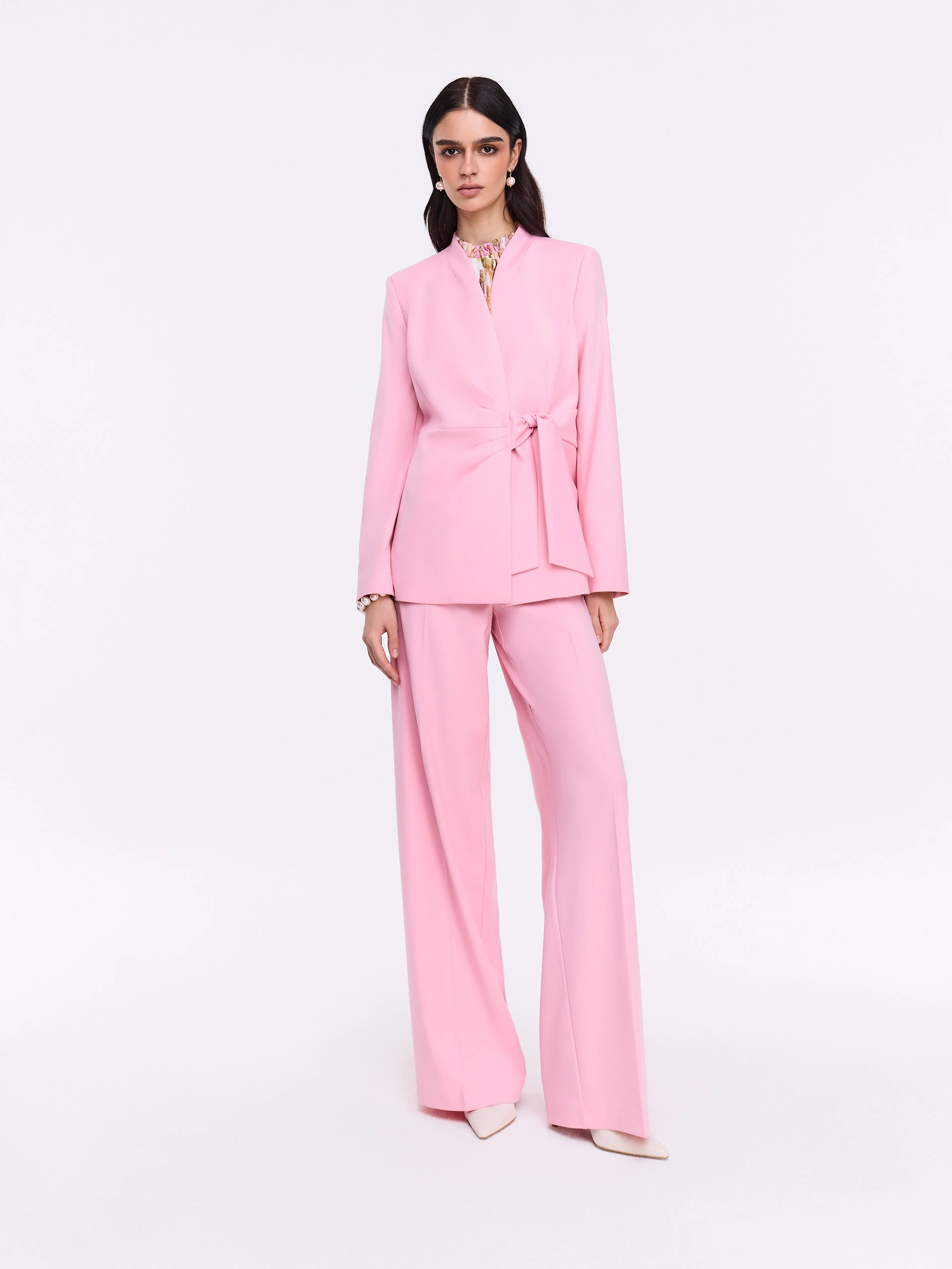 Unique pink jacket with a tie at the waist