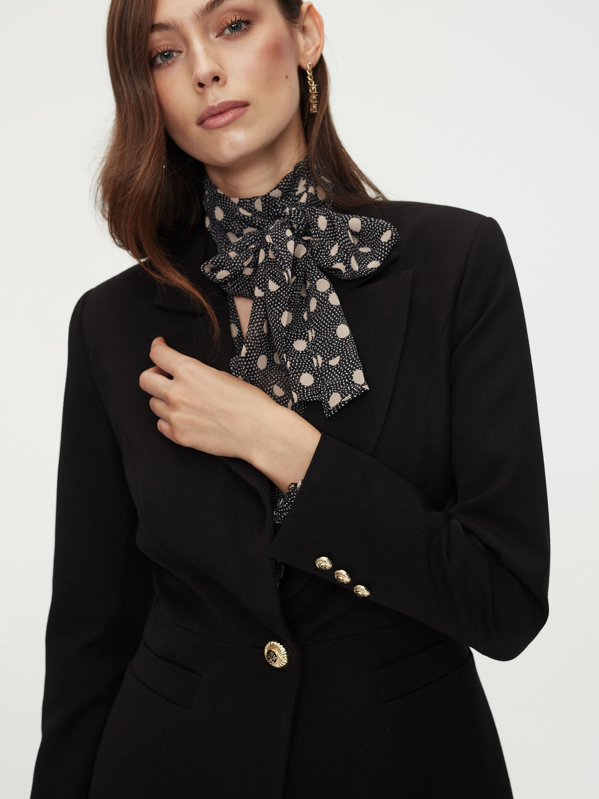 Black jacket with golden button