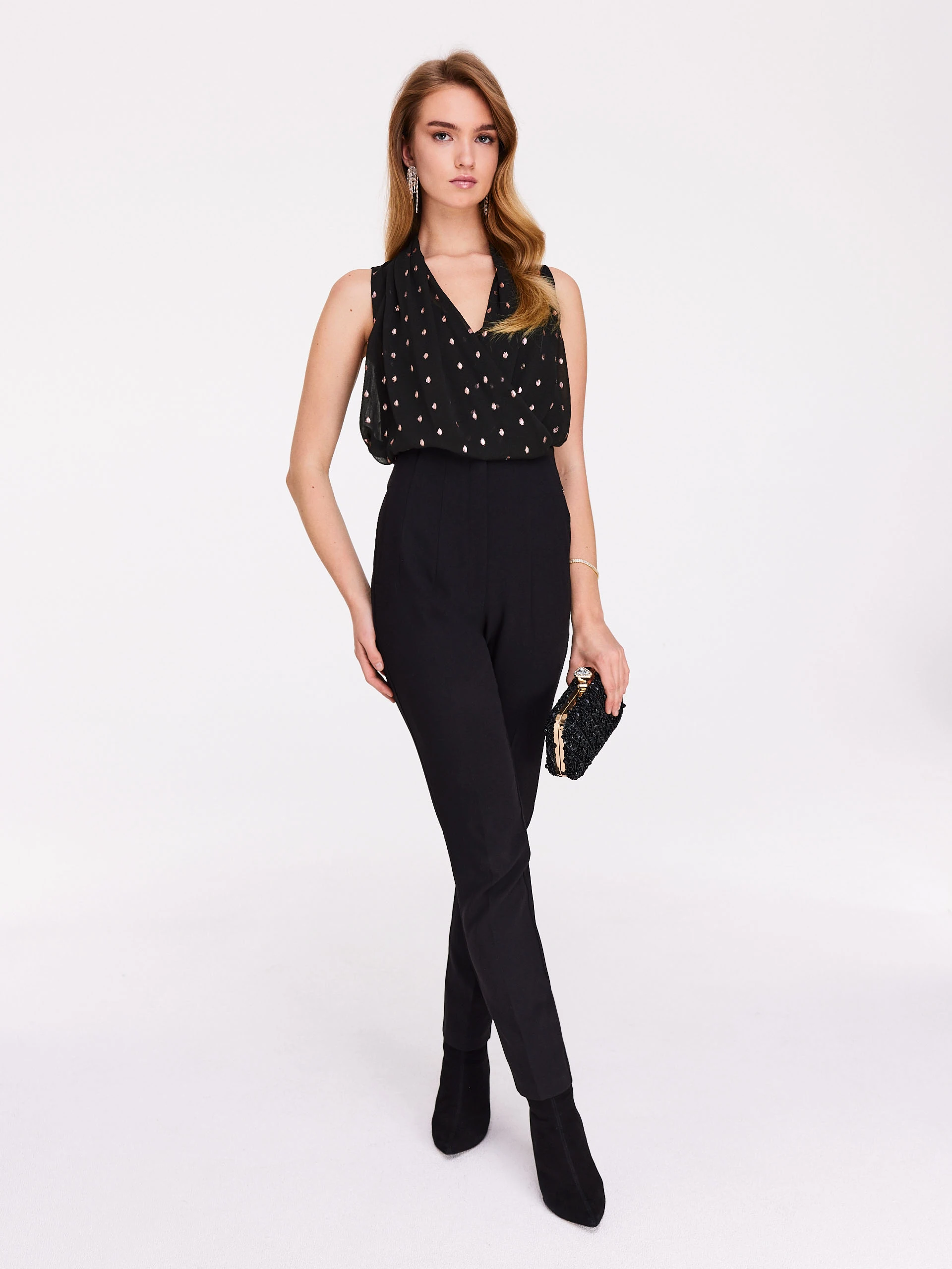 Black sleeveless blouse with fine pattern