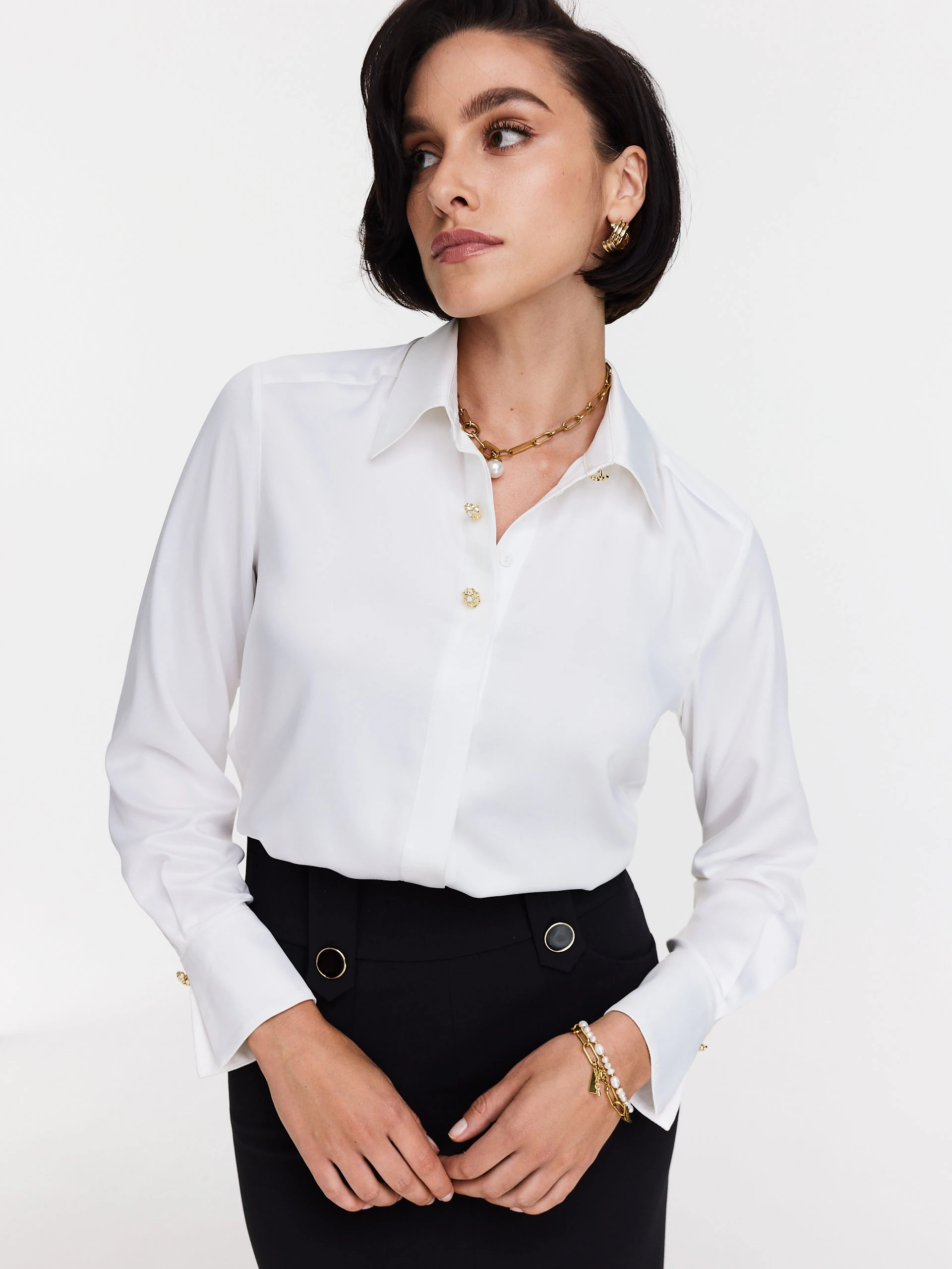 Elegant white shirt with decorative buttons