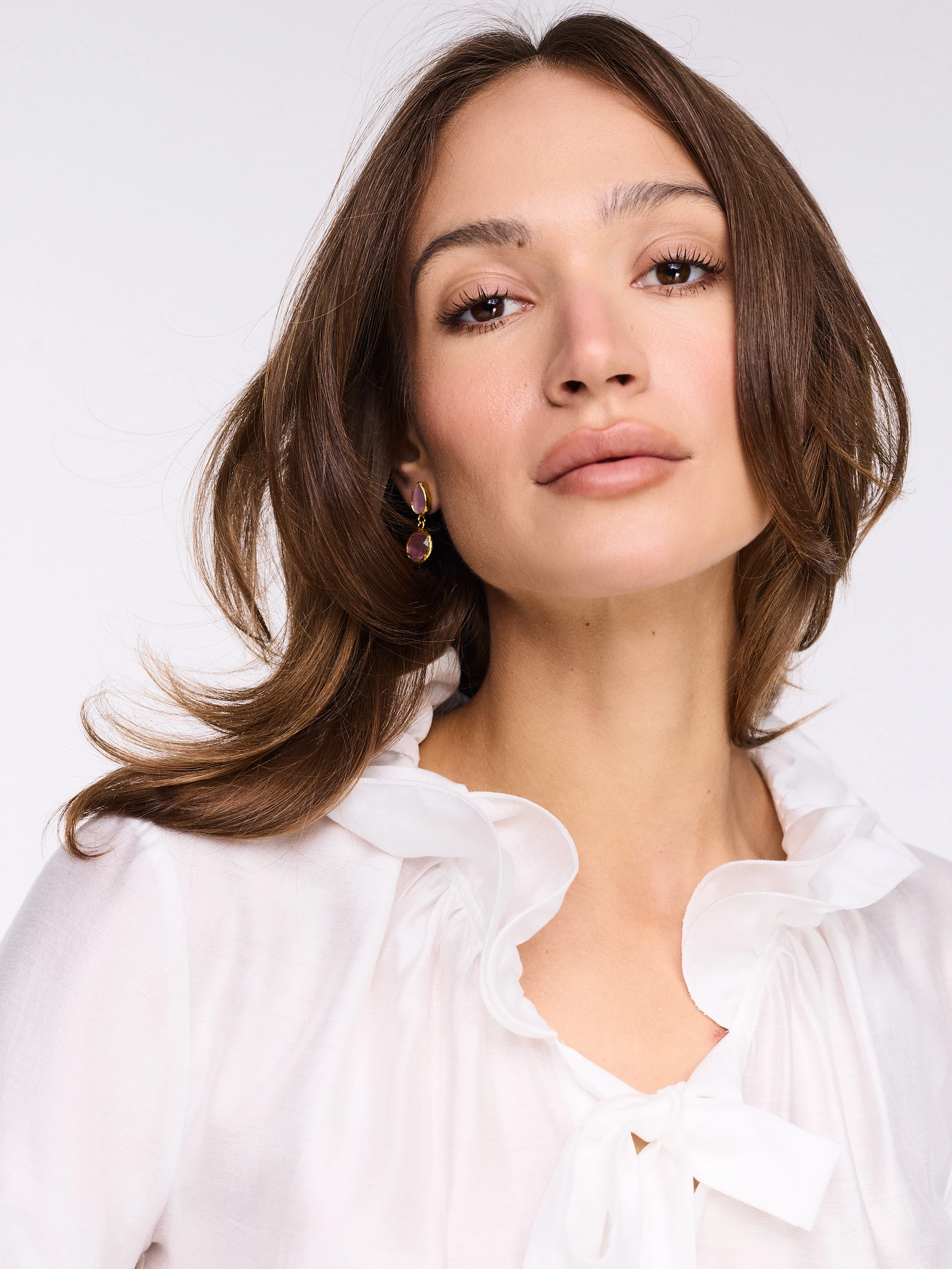White blouse with a tie at the neck