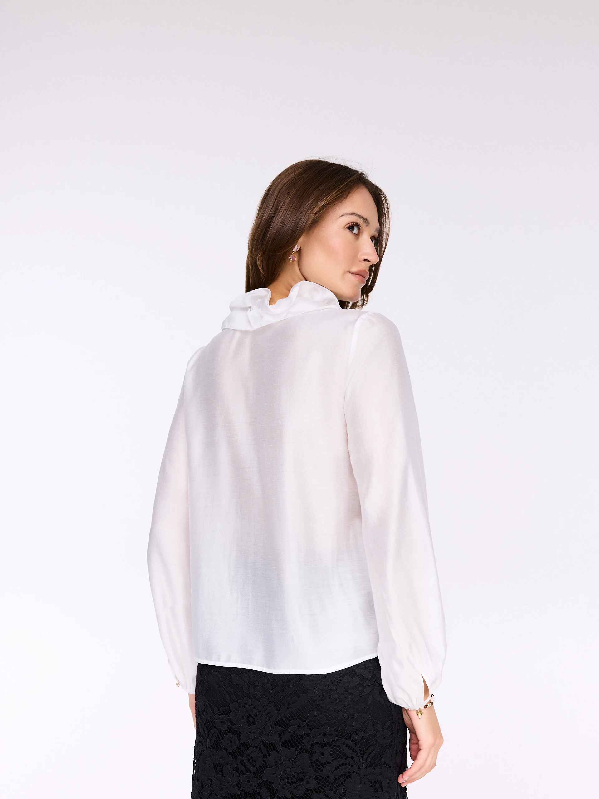 White blouse with a tie at the neck