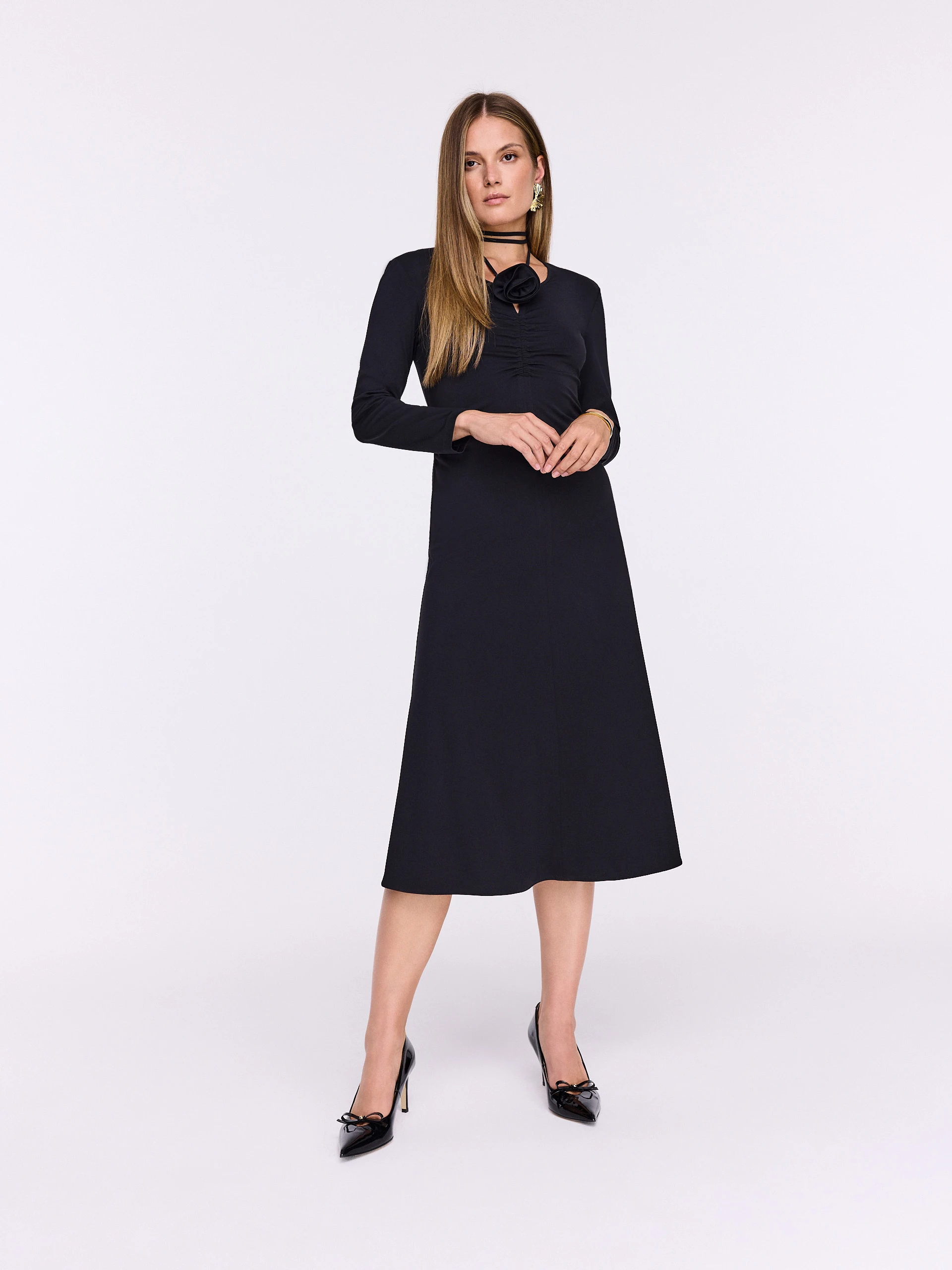 Black midi dress with decorative rose