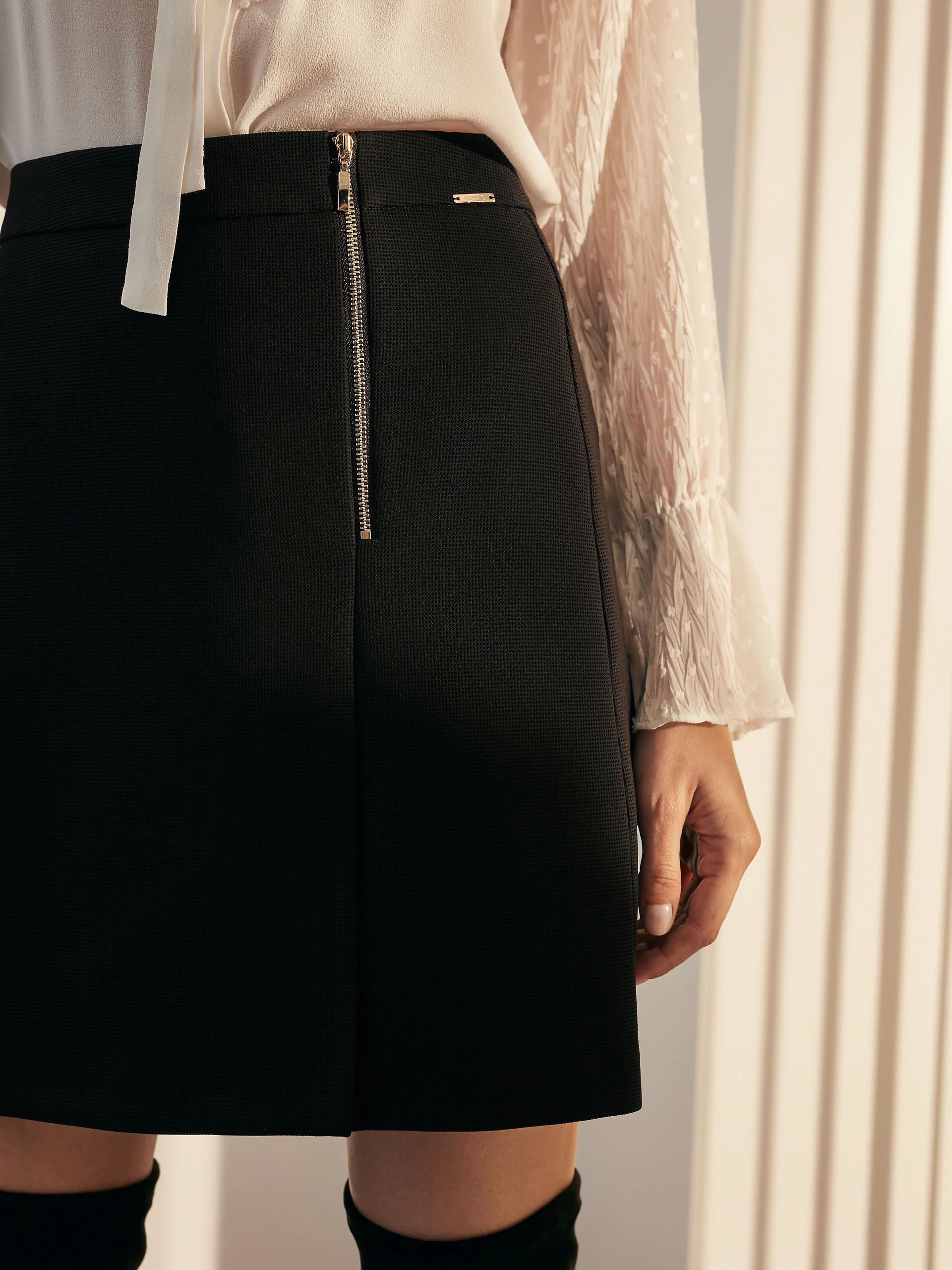 TRAPEZE SKIRT WITH CUT-OUTS