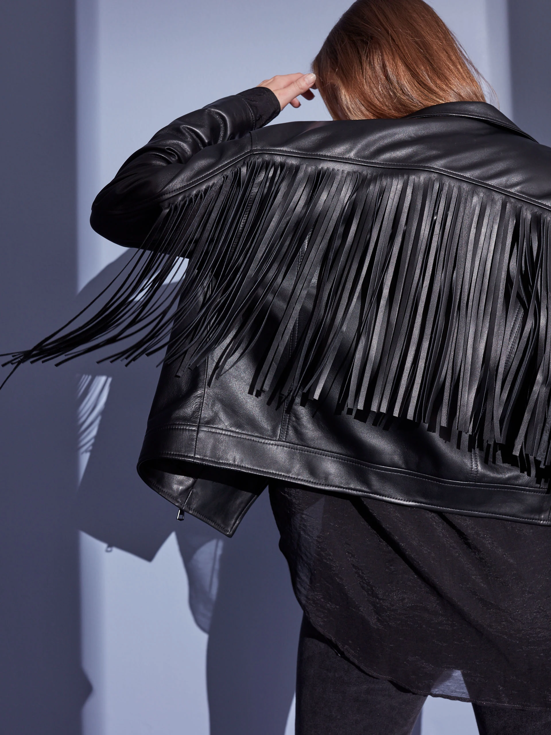 BLACK LEATHER RAMONESKI WITH TASSELS