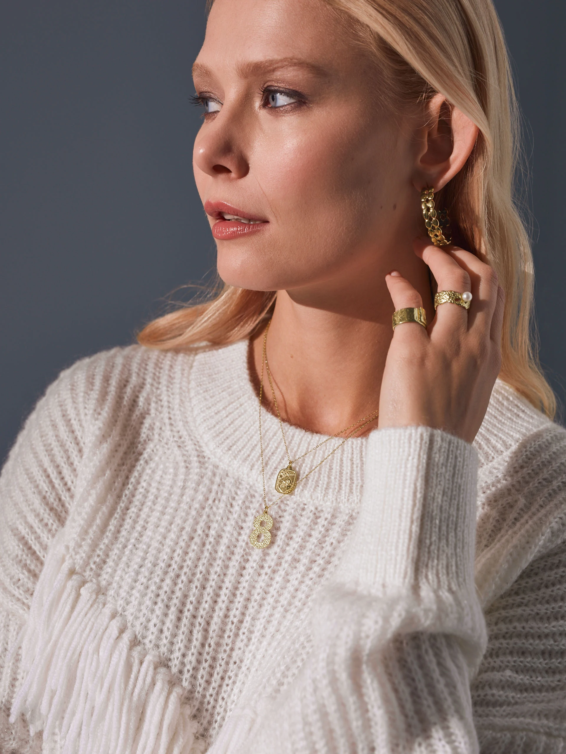 SWEATER WITH TASSELS