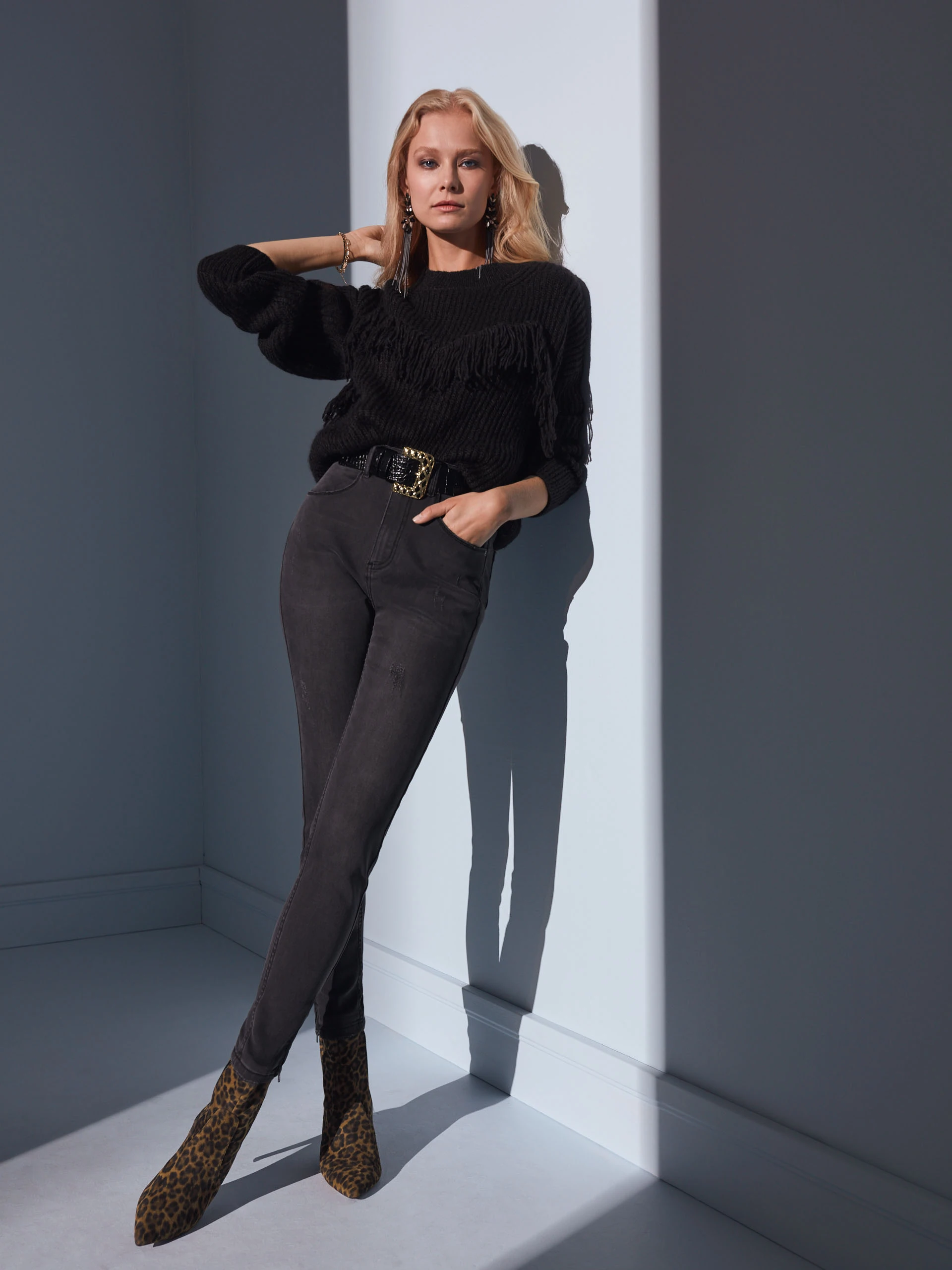 BLACK SWEATER WITH TASSELS
