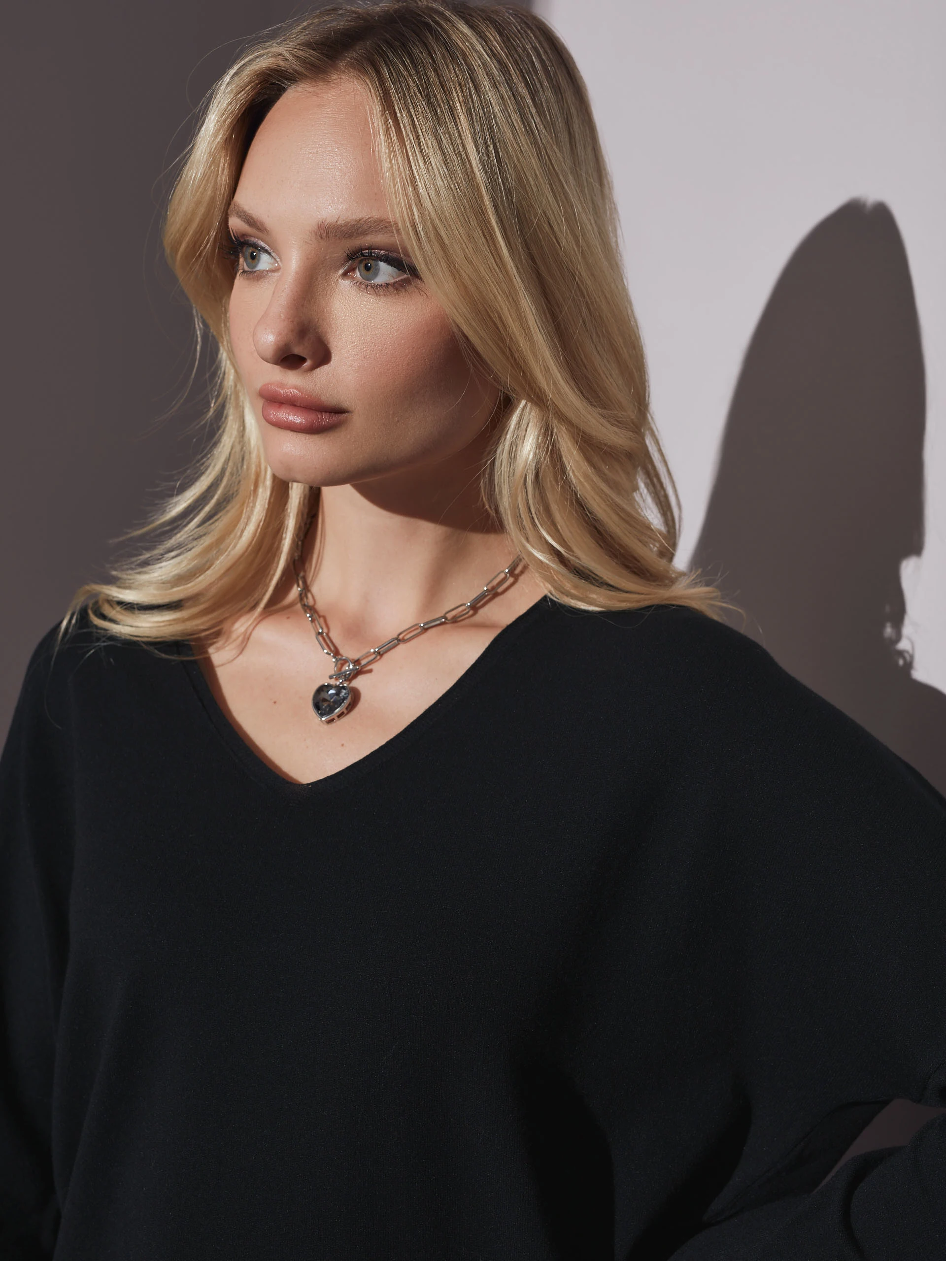 Black sweater with heart neckline