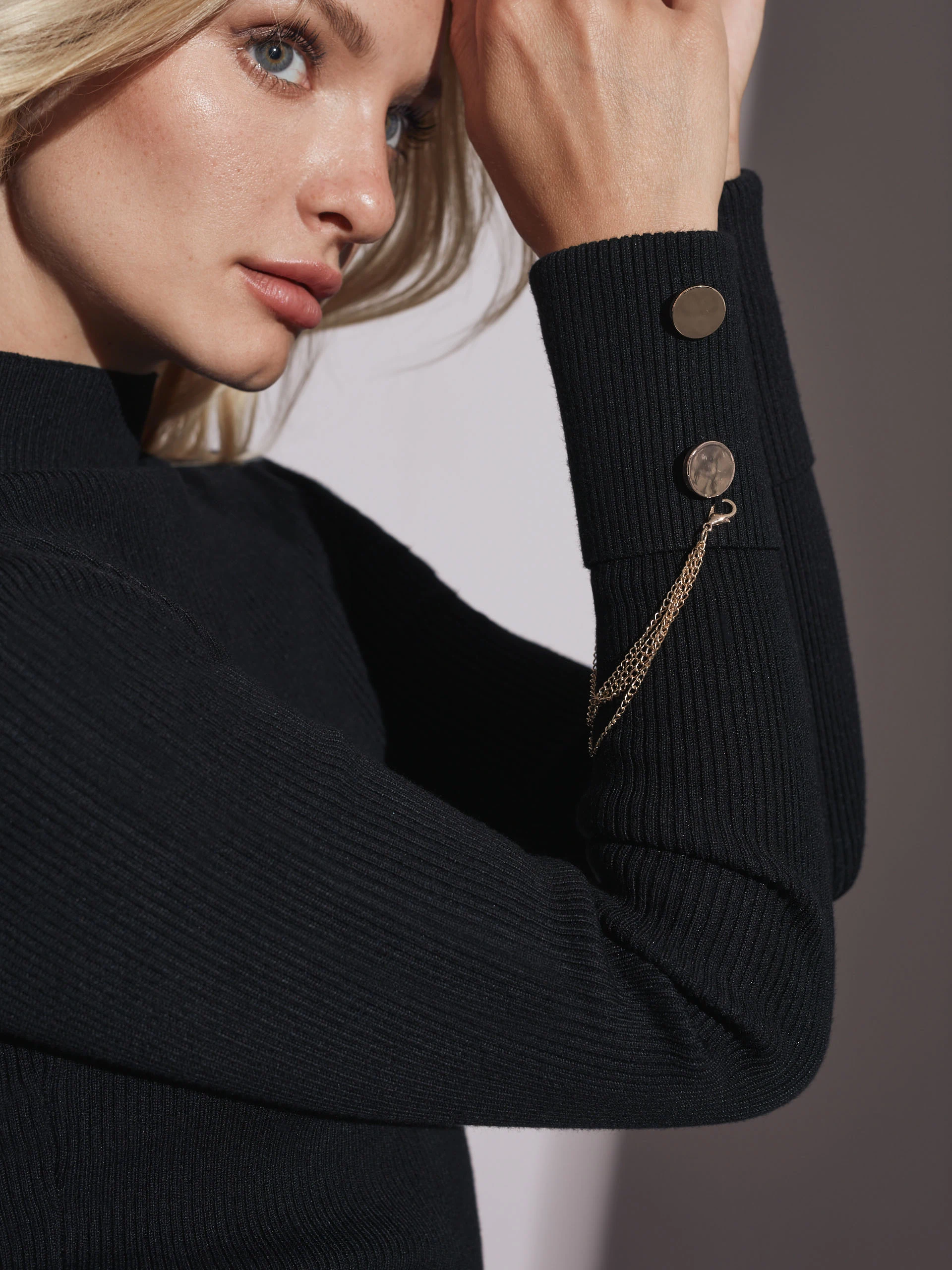 BLACK TURTLENECK WITH JEWELRY DETAIL