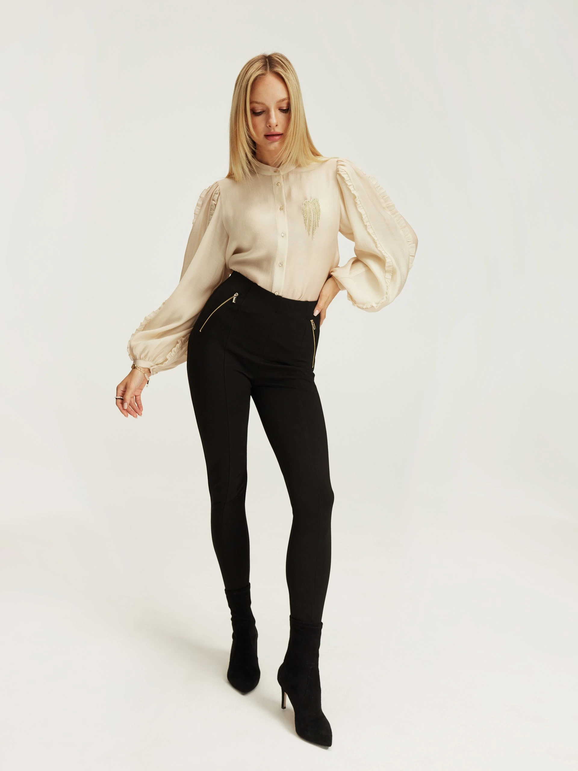 Black fitted pants with zippers