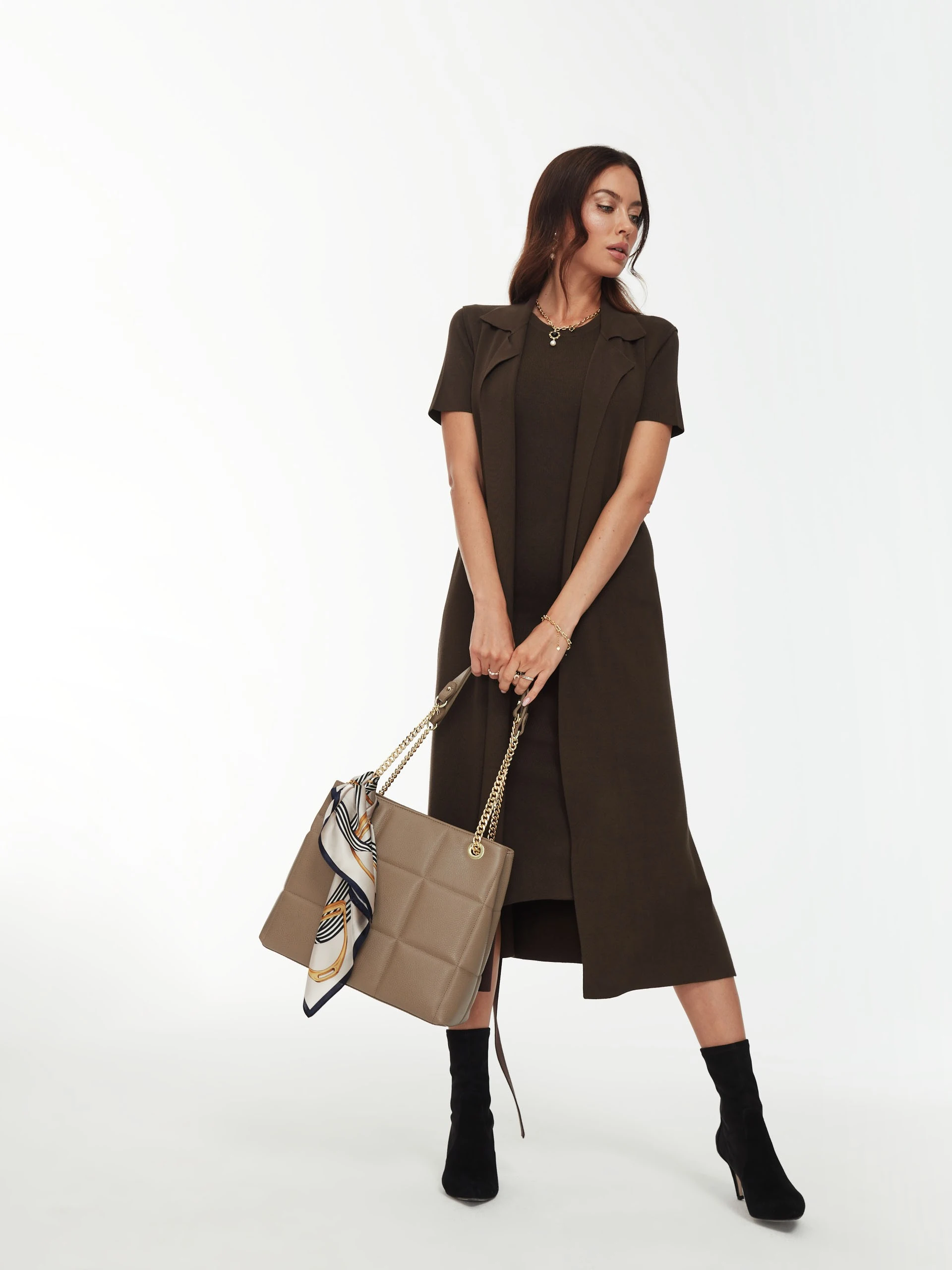 Long brown sleeveless sweater