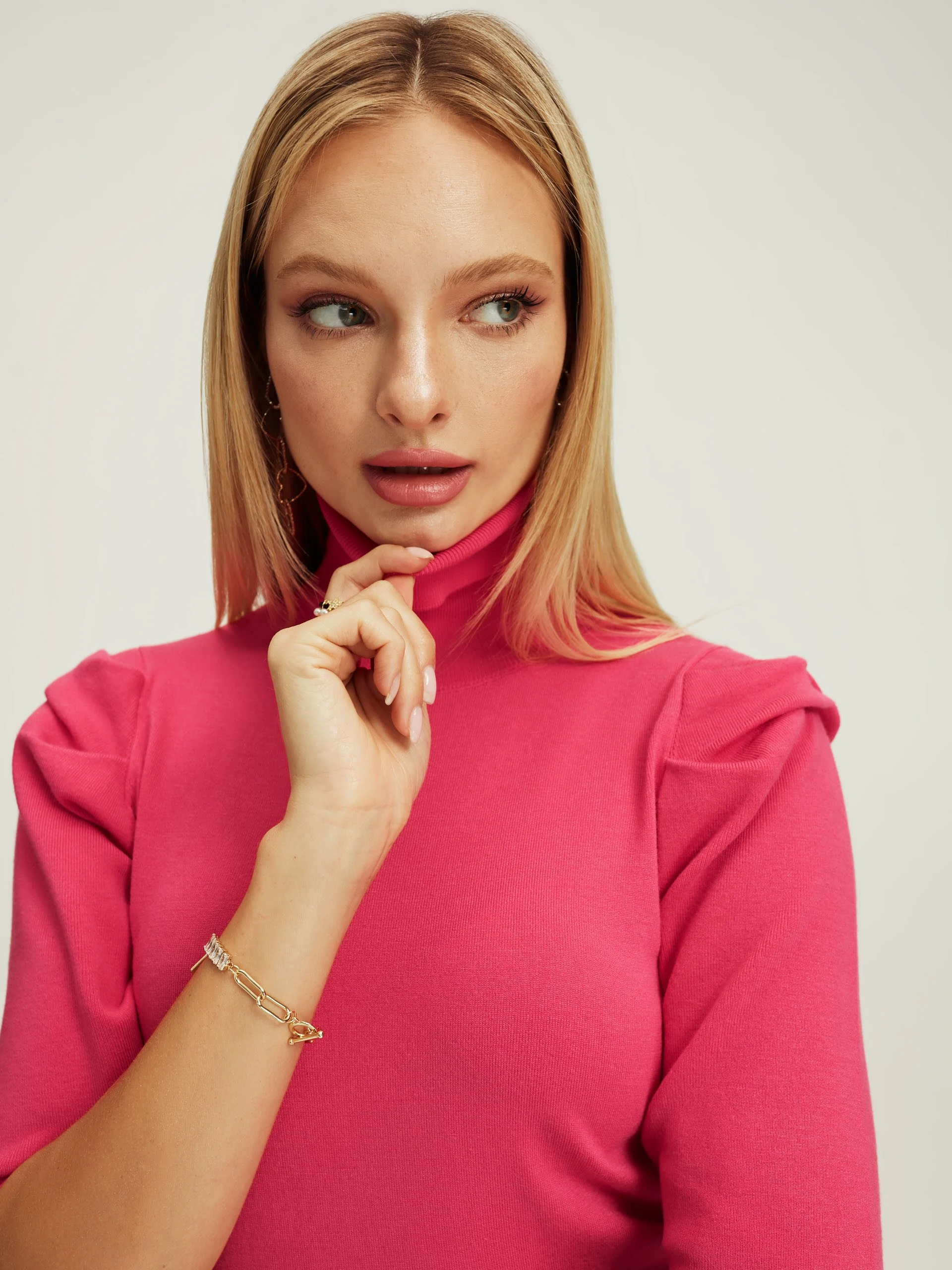 Pink turtleneck with buff sleeves