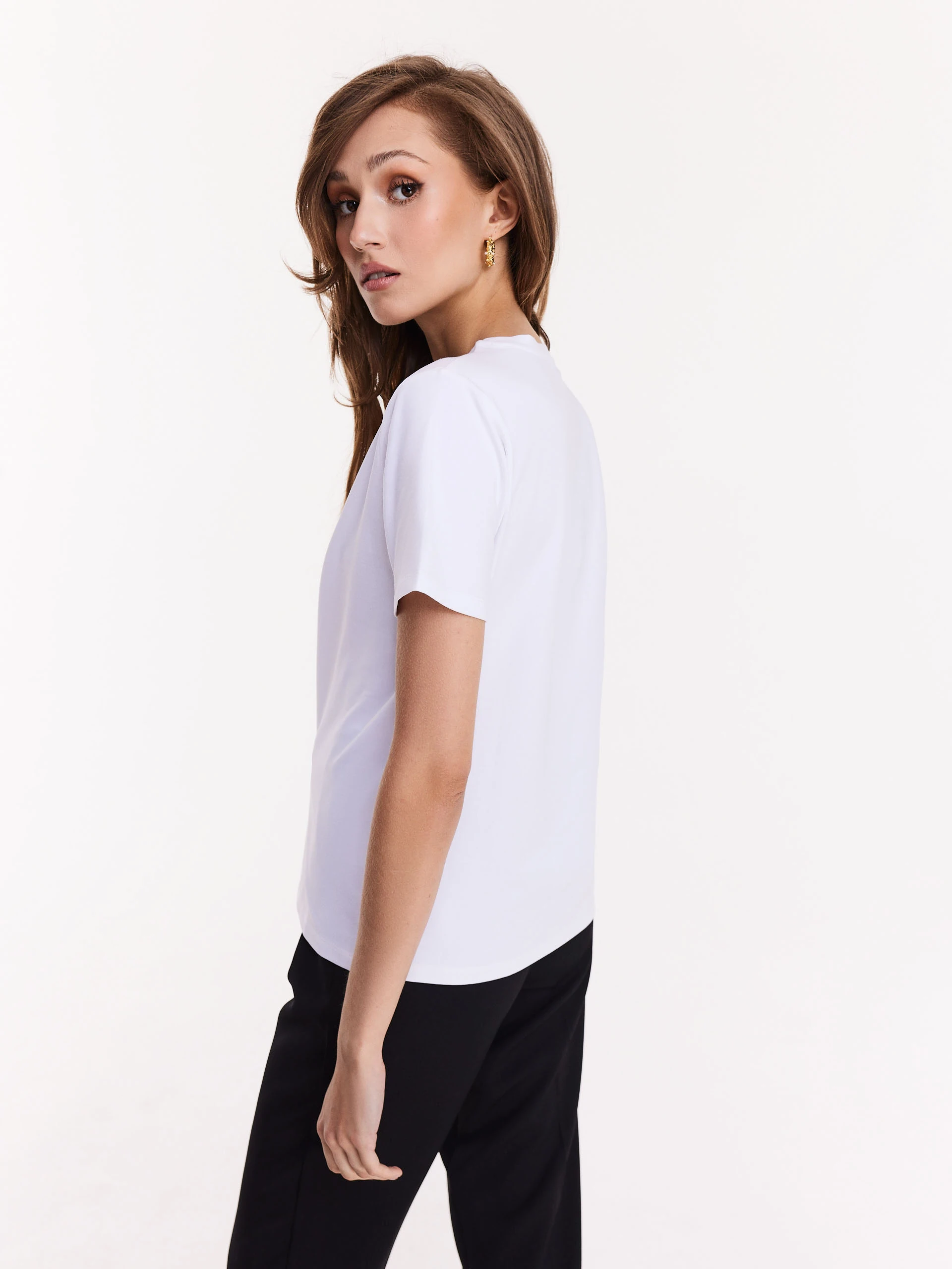 White blouse with short sleeves and decorative patch