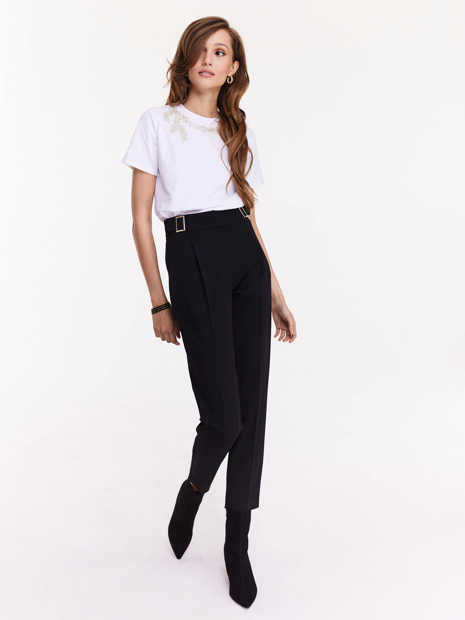 White blouse with short sleeves and decorative patch