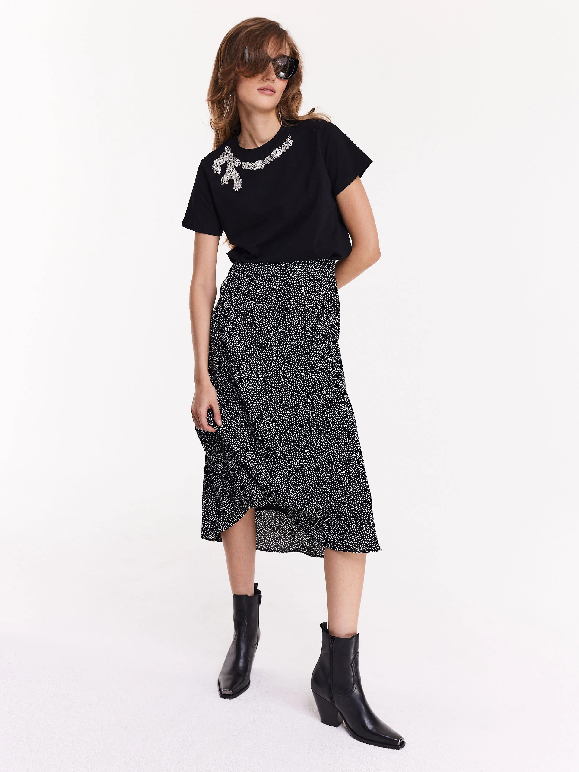 Black blouse with short sleeves and decorative patch
