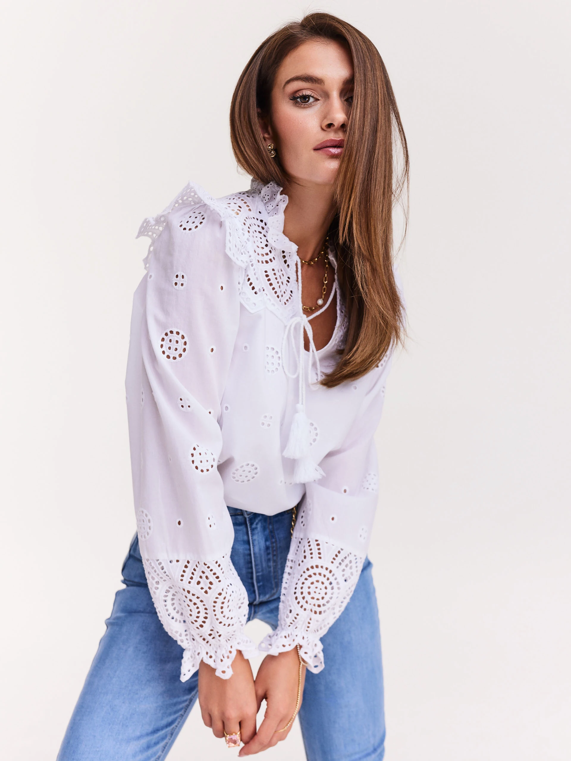 White blouse with openwork inserts