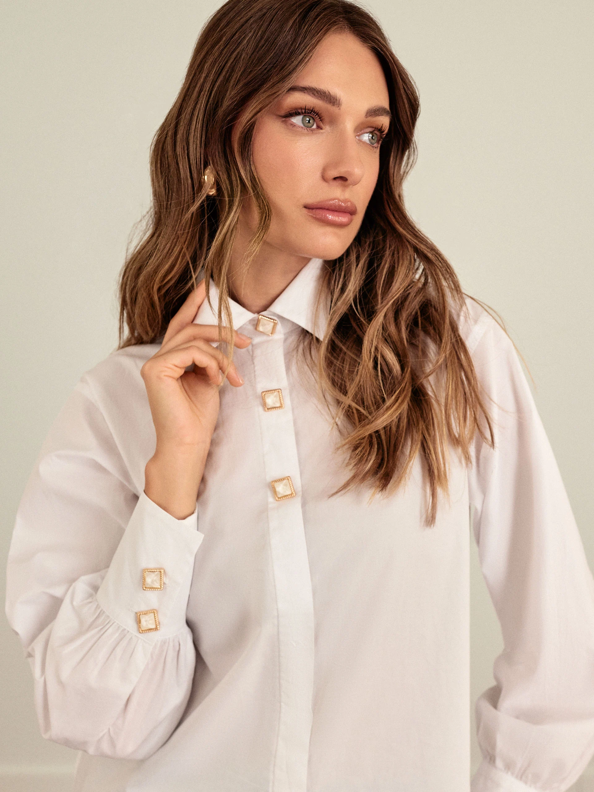 White shirt with decorative buttons