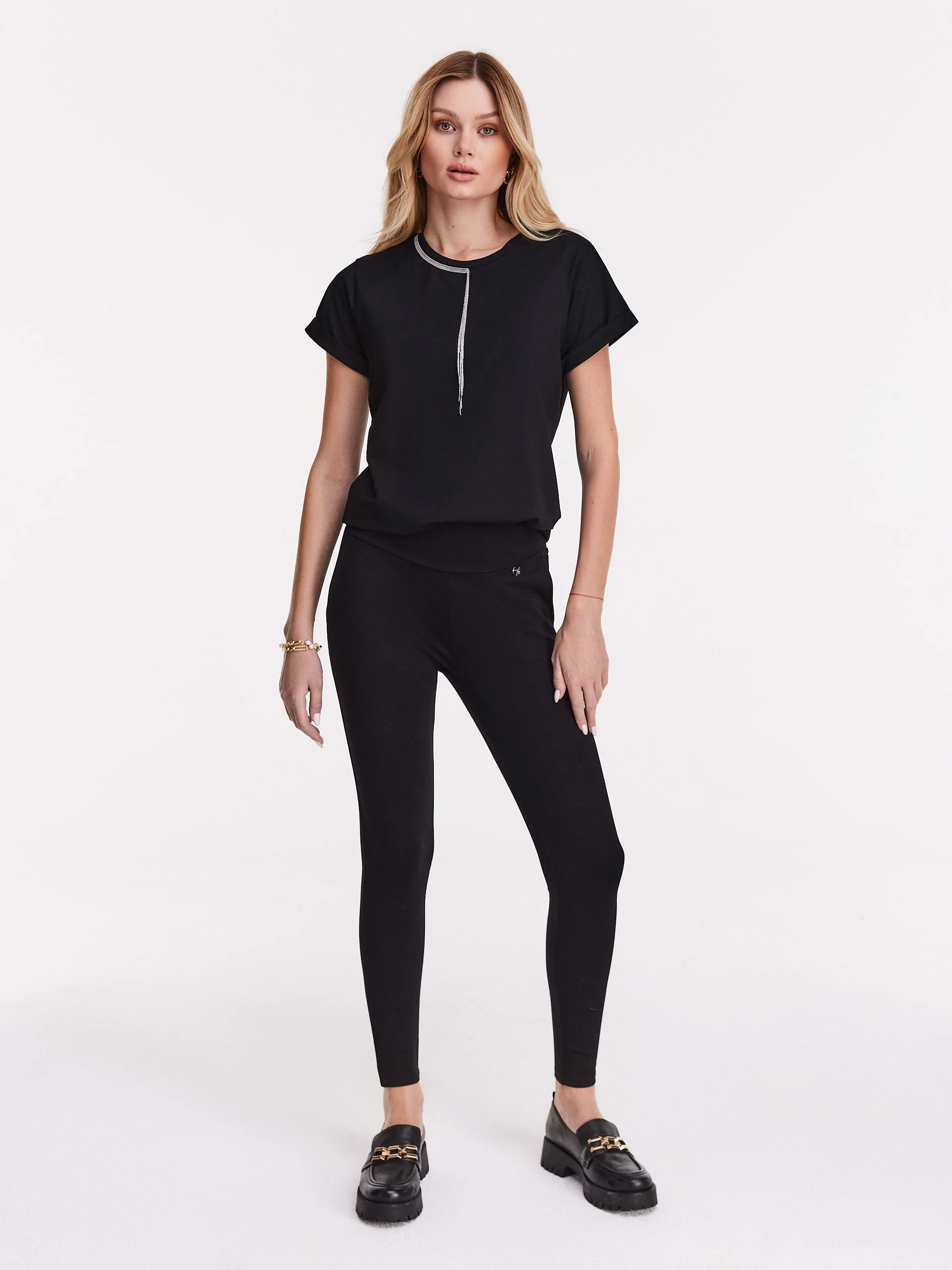 Black leggings pants with silver zipper closure