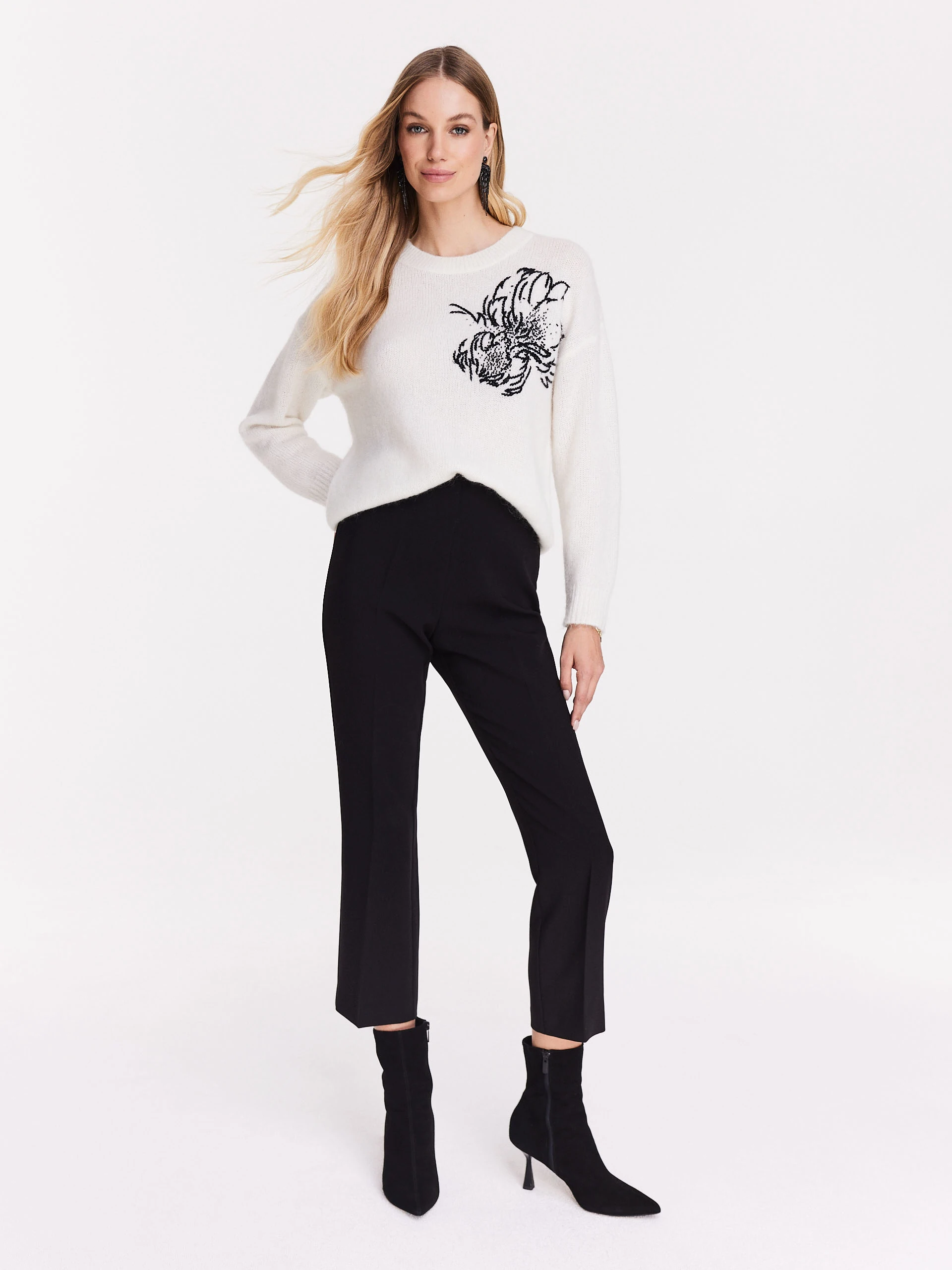 White sweater with applique
