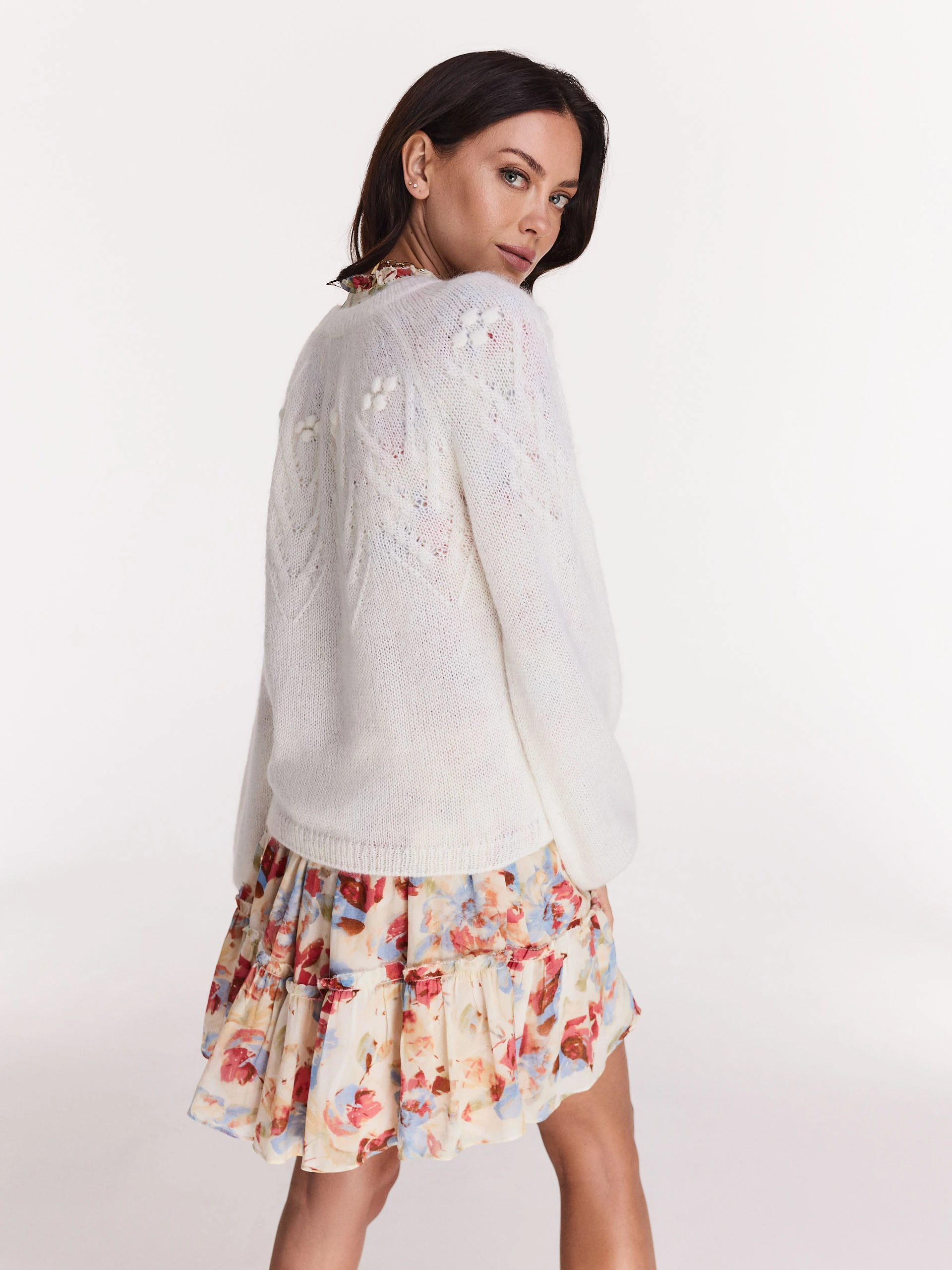 Loose white sweater with round neckline