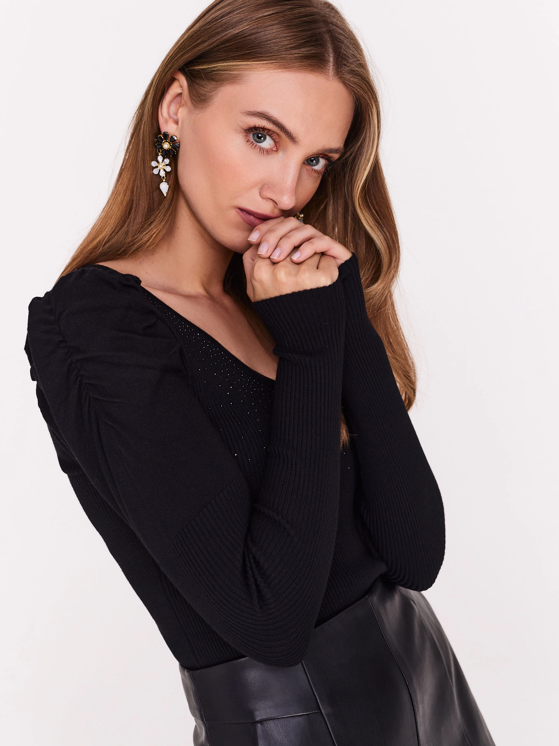 Black sweater with buffets and beads