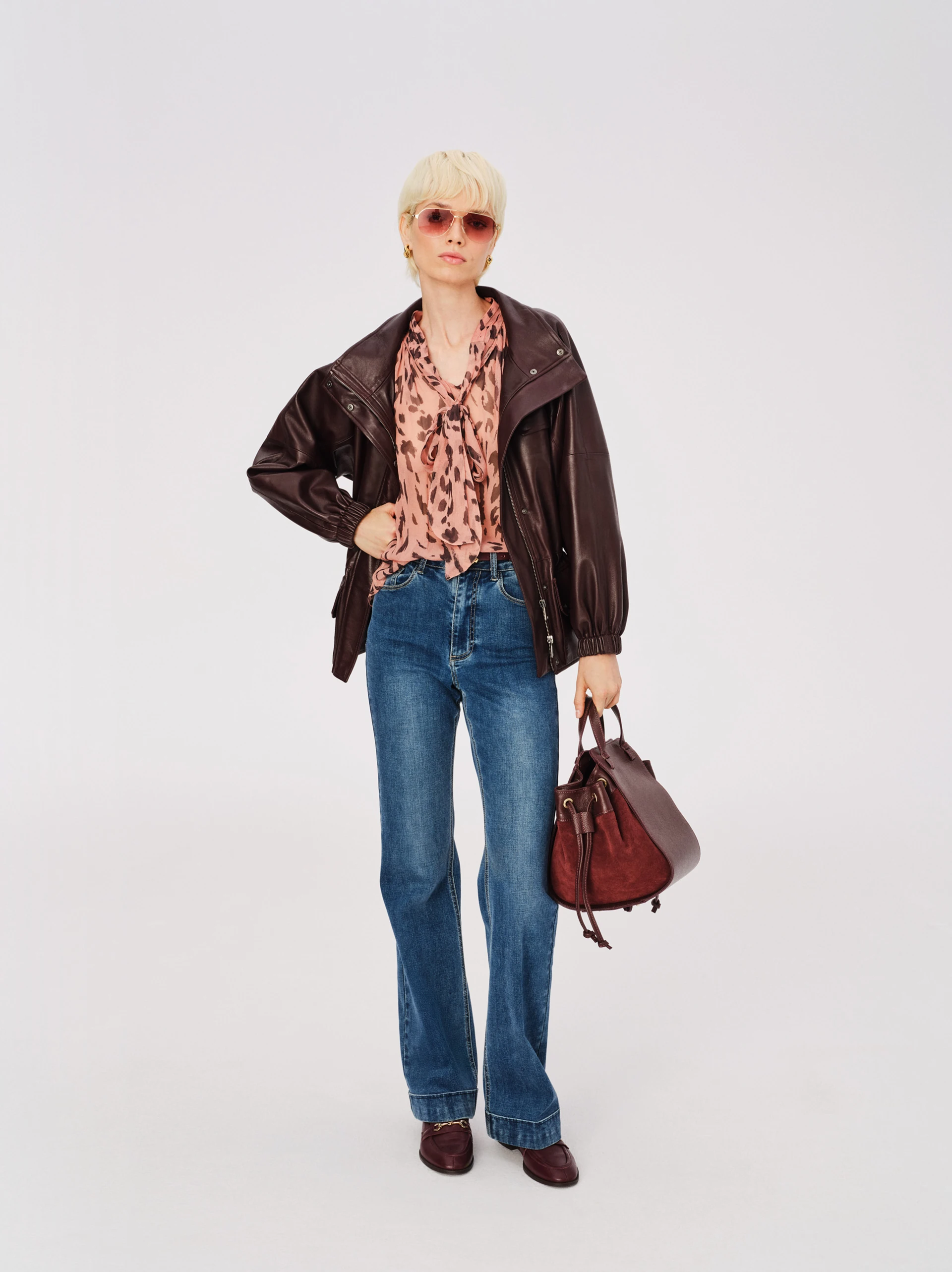 Airy pink spotted blouse with a tie at the neck