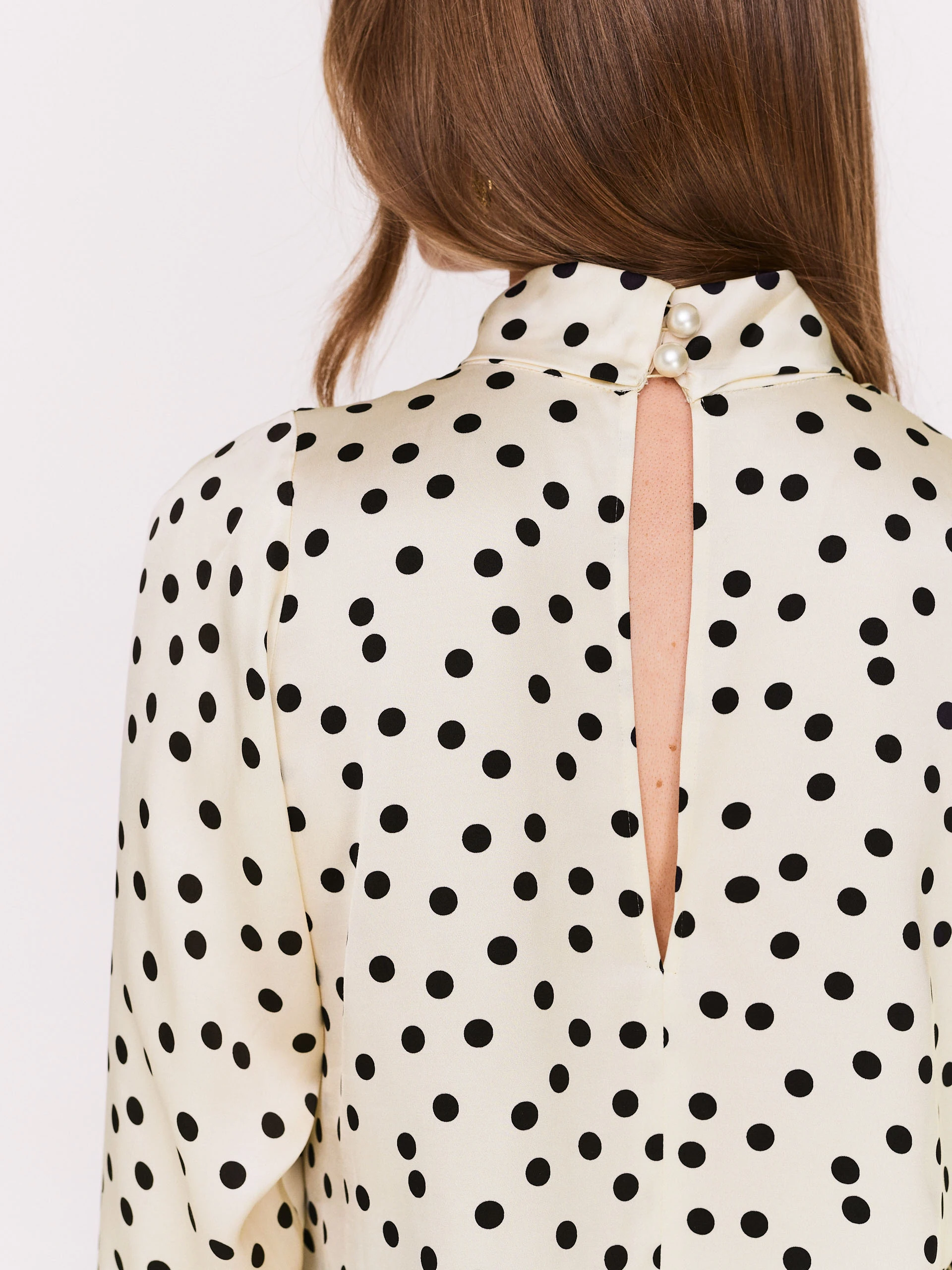 Cream pea blouse with pearl brooch