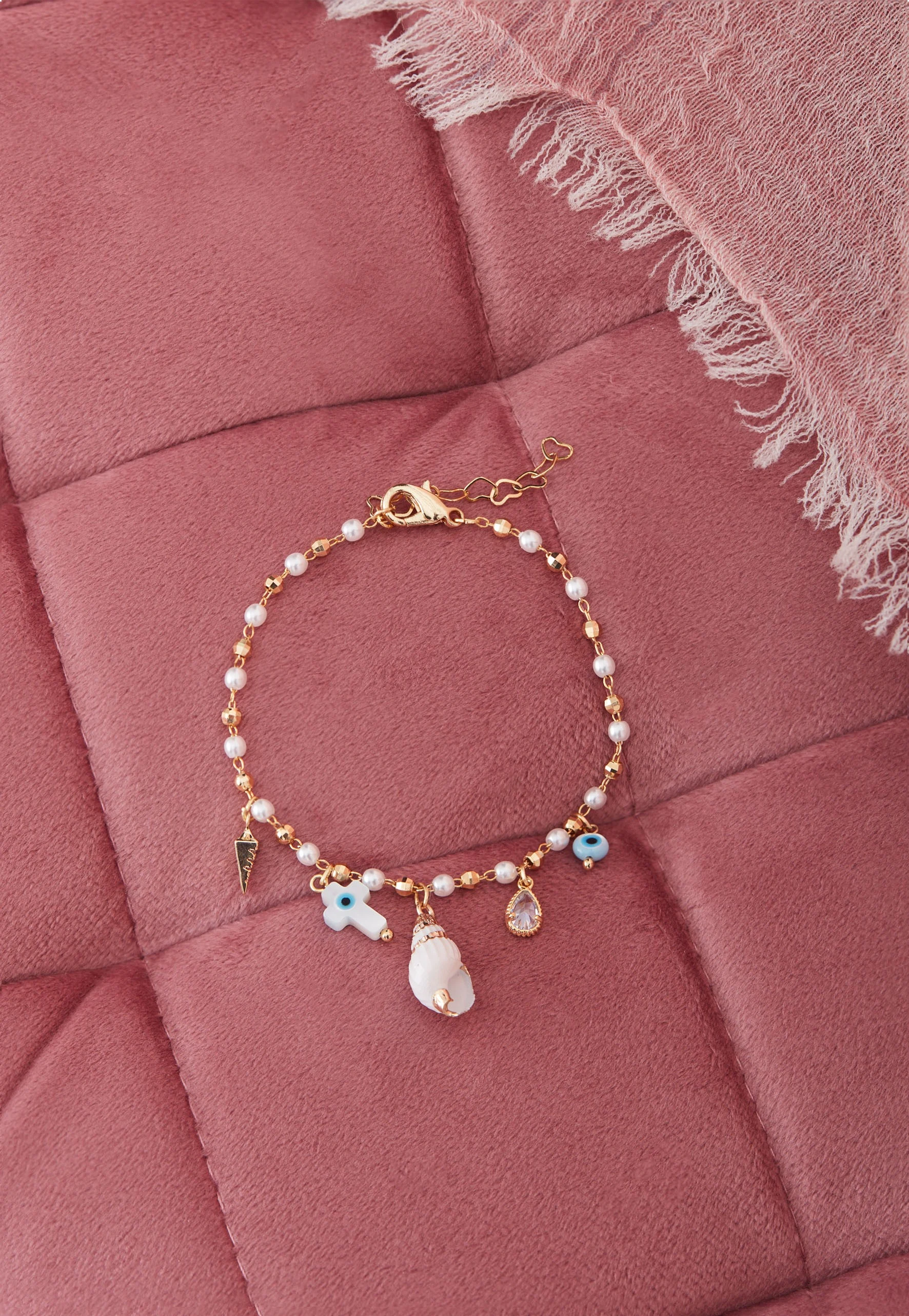 PEARL BRACELET WITH CHARMS