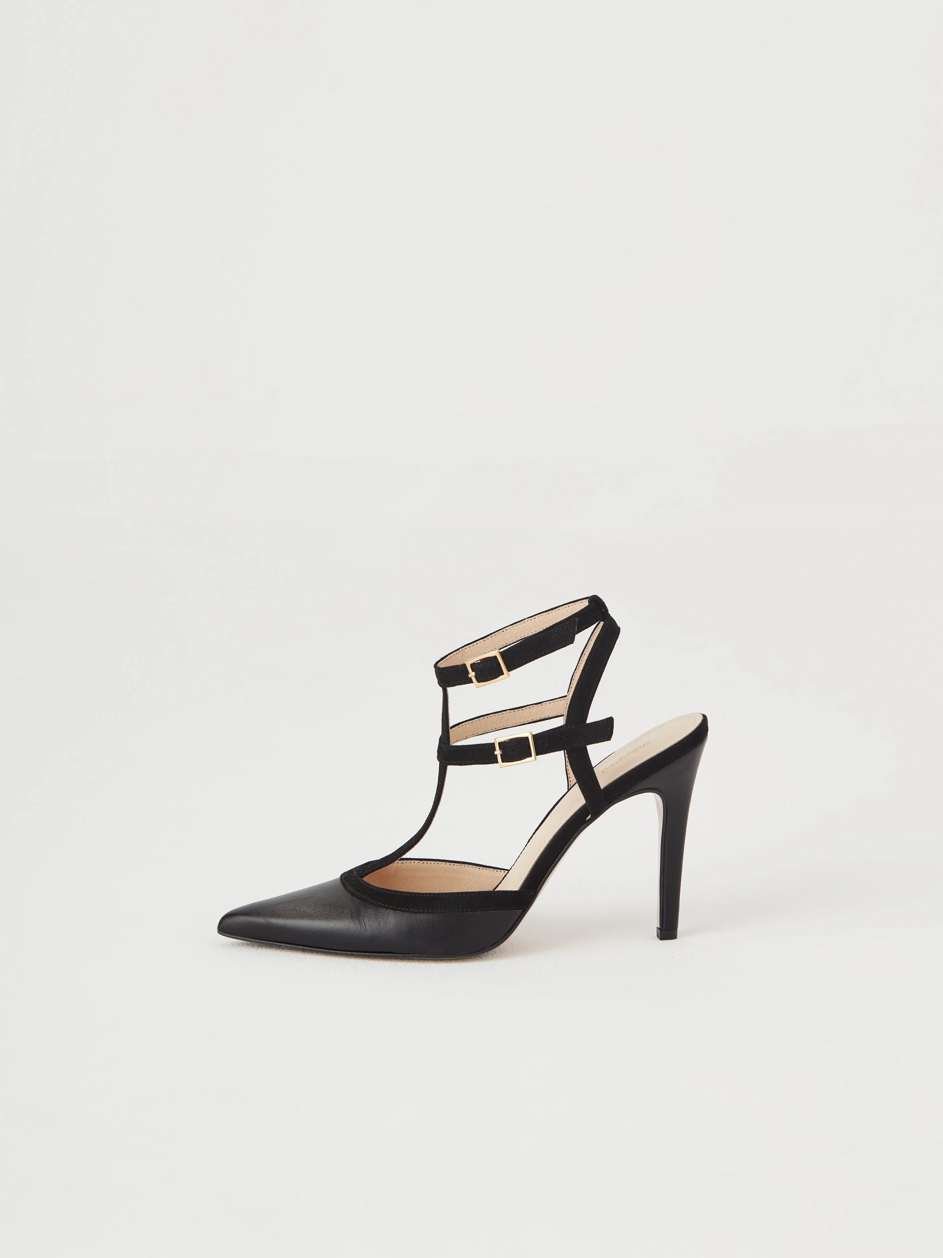 Black leather pumps