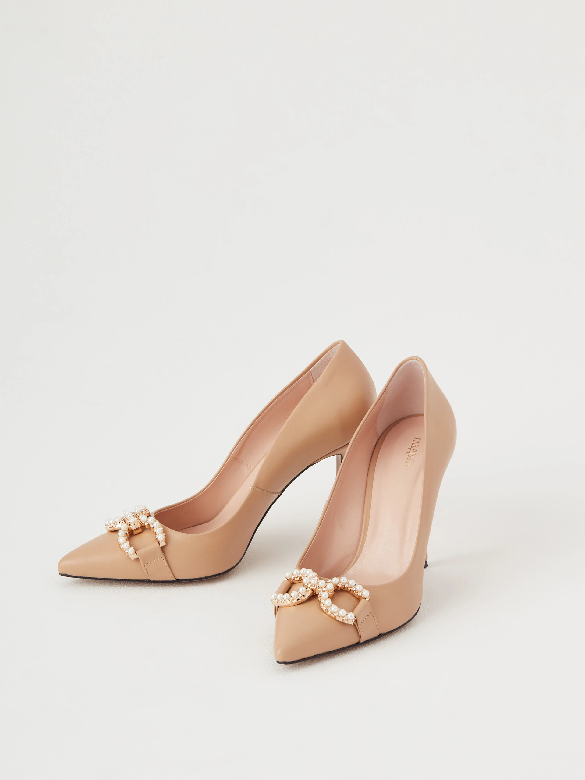 Beige leather pumps