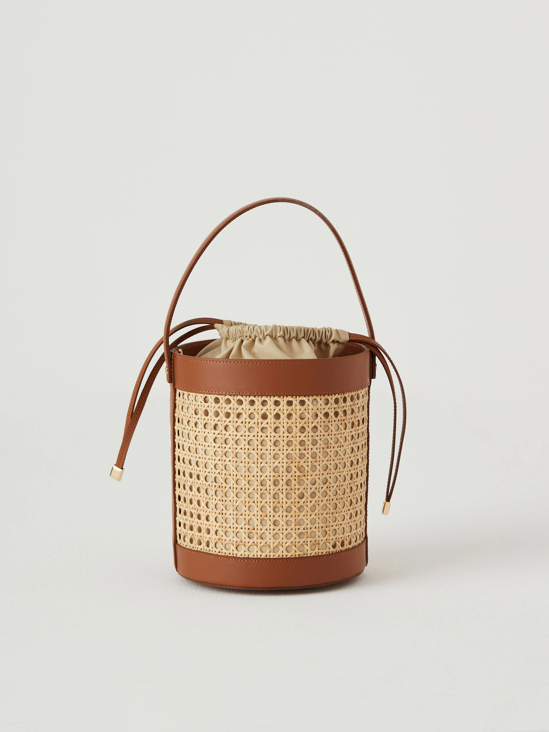 Leather and raffia bucket bag
