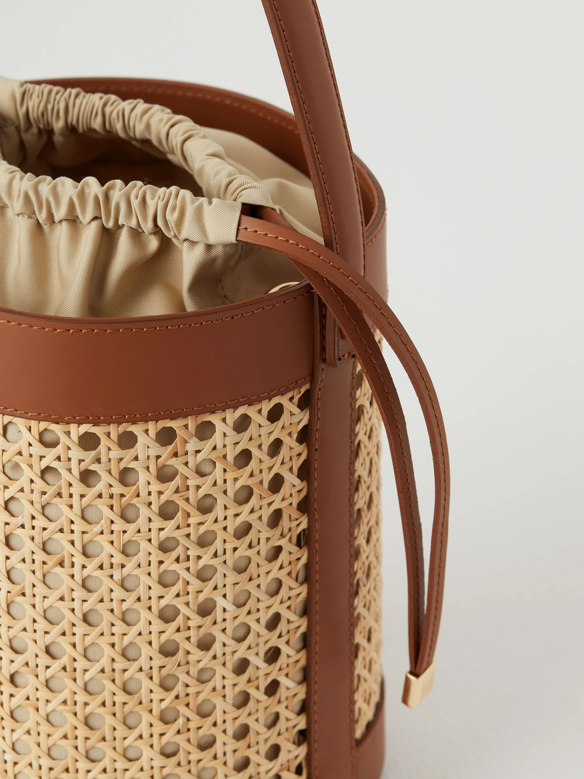 Leather and raffia bucket bag