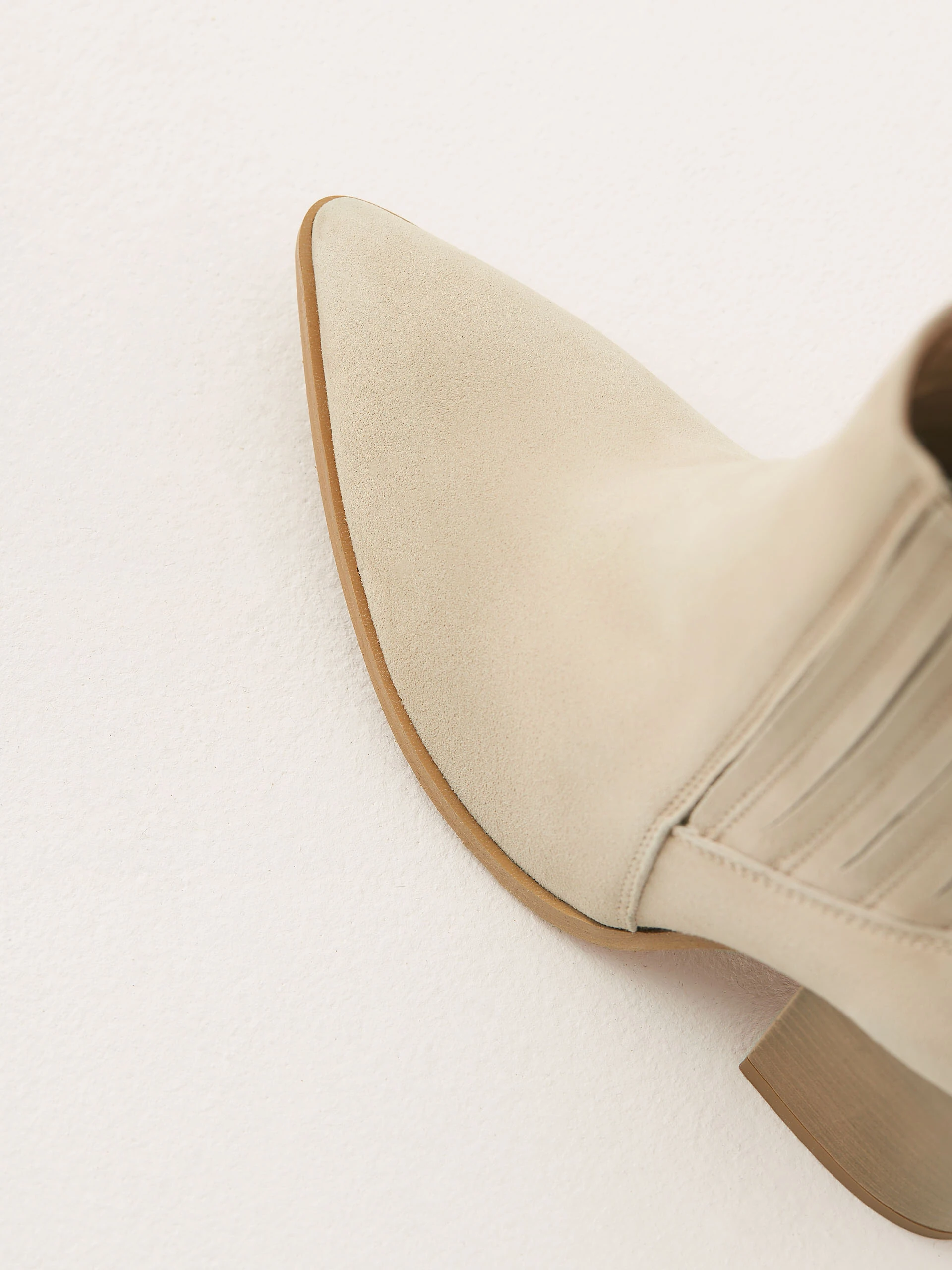 Beige leather heeled cowboy boots