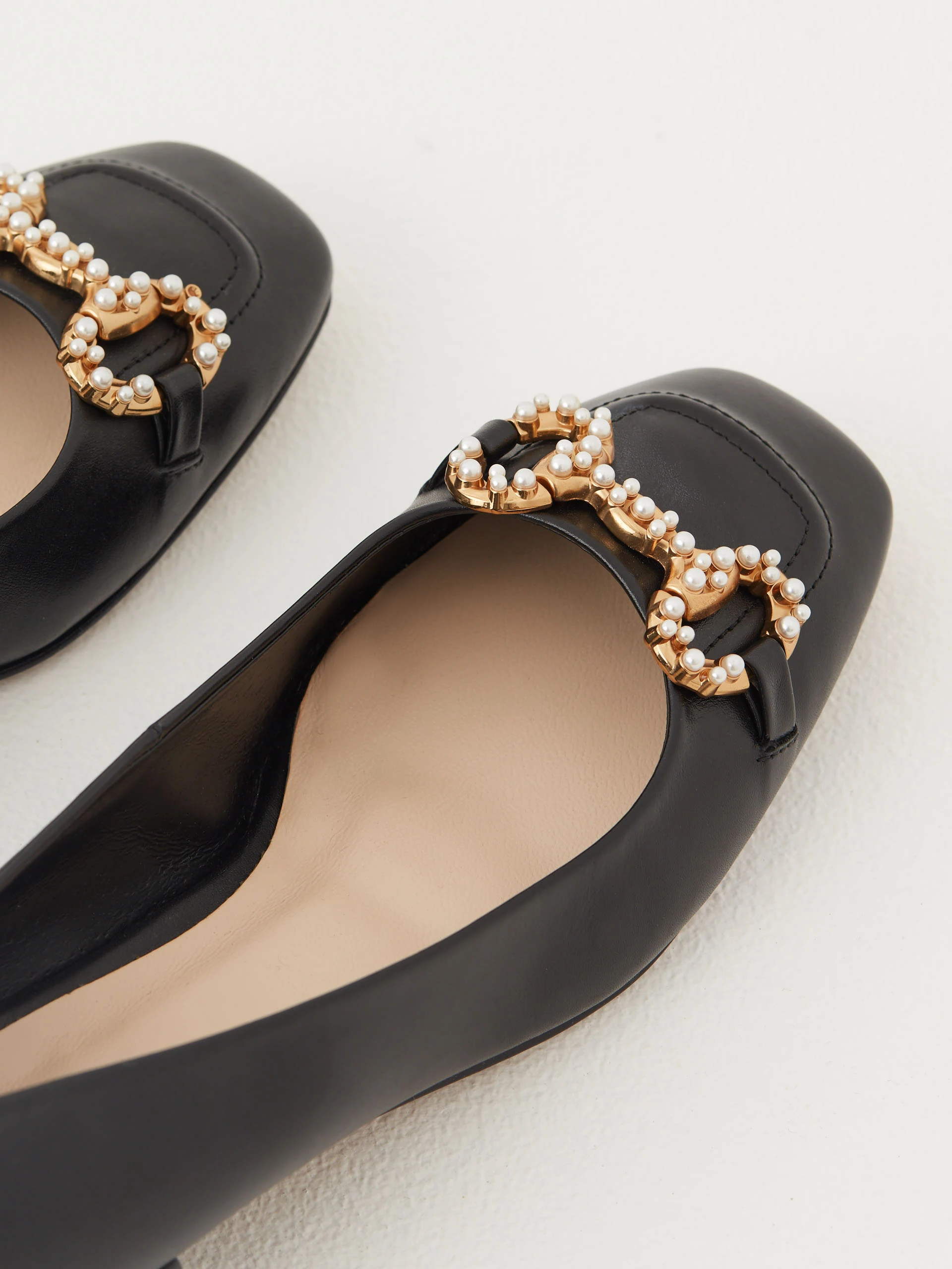Black leather ballerinas decorated with buckles