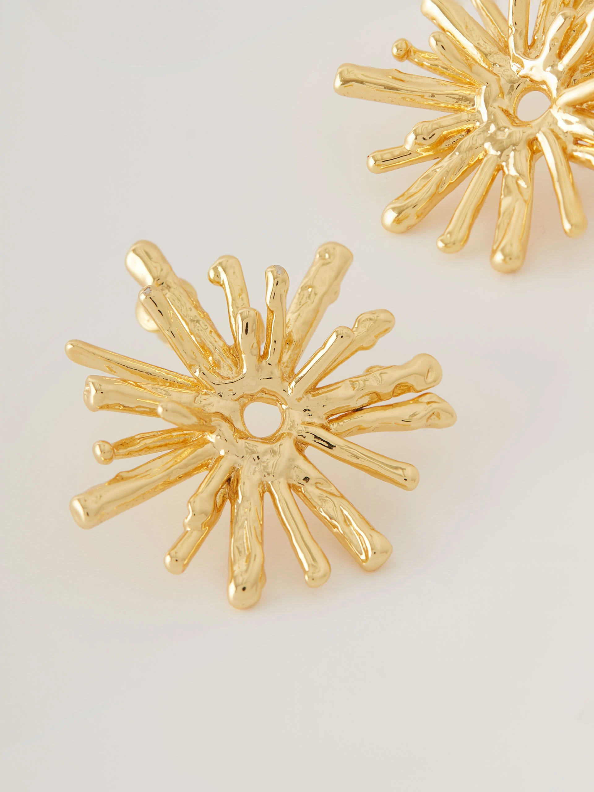 Earrings in the shape of sun