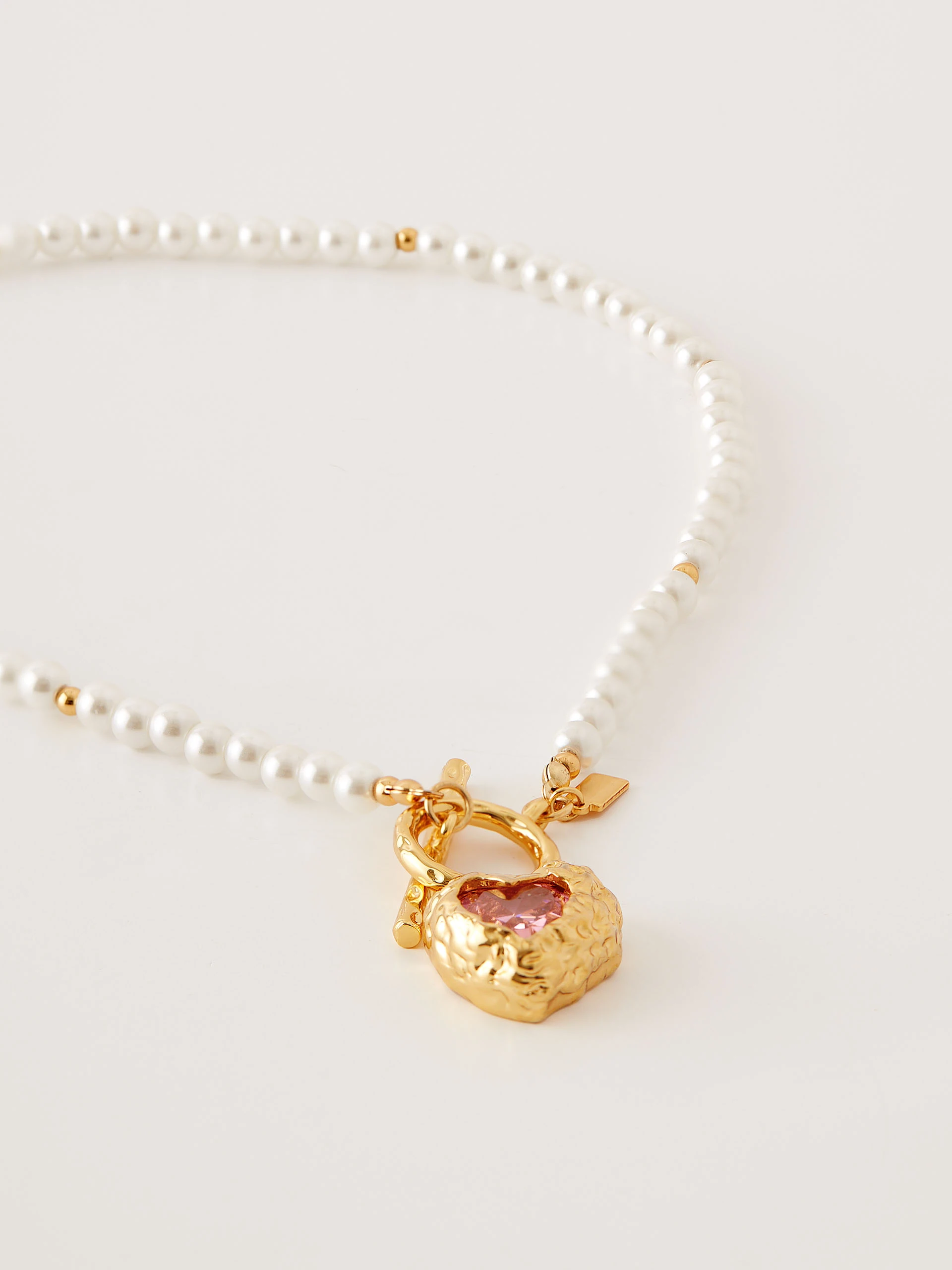 Necklace with pearls and heart-shaped pendant