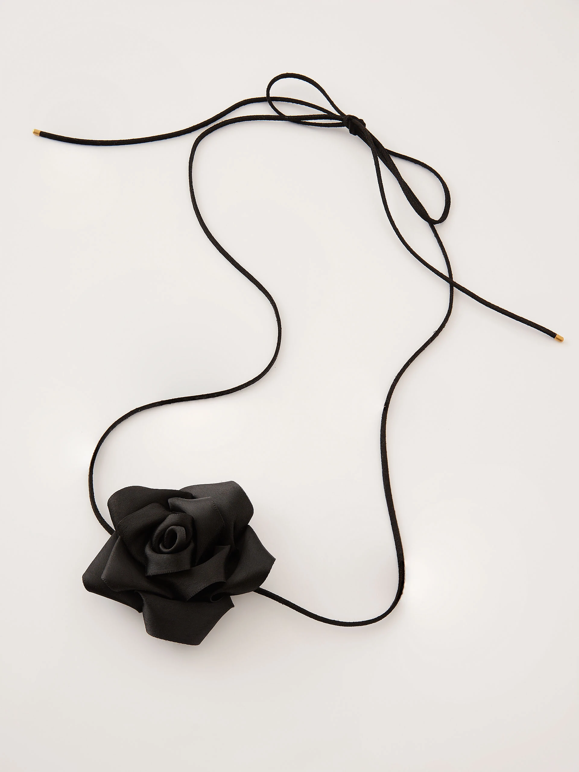 Black rose necklace on a thong