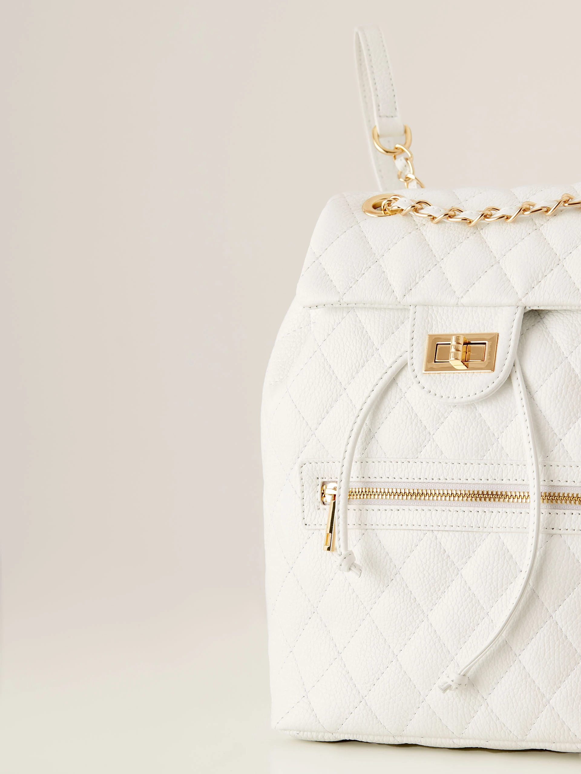 White quilted leather backpack