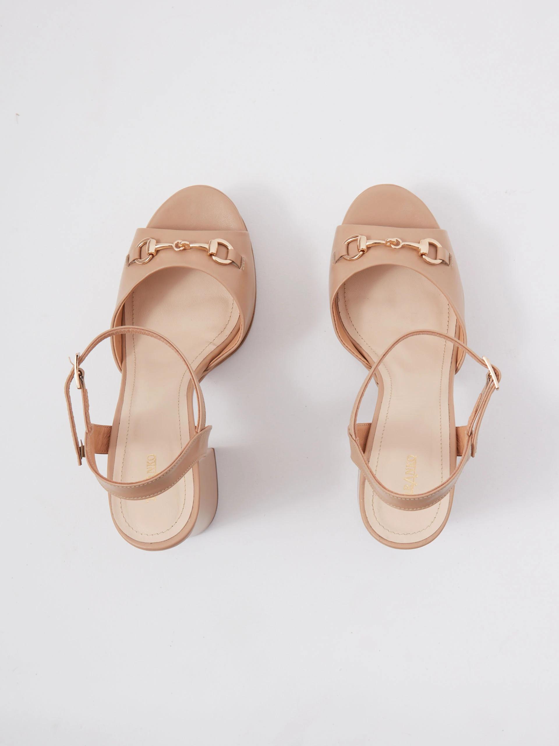 Beige leather platform sandals with buckle detailing