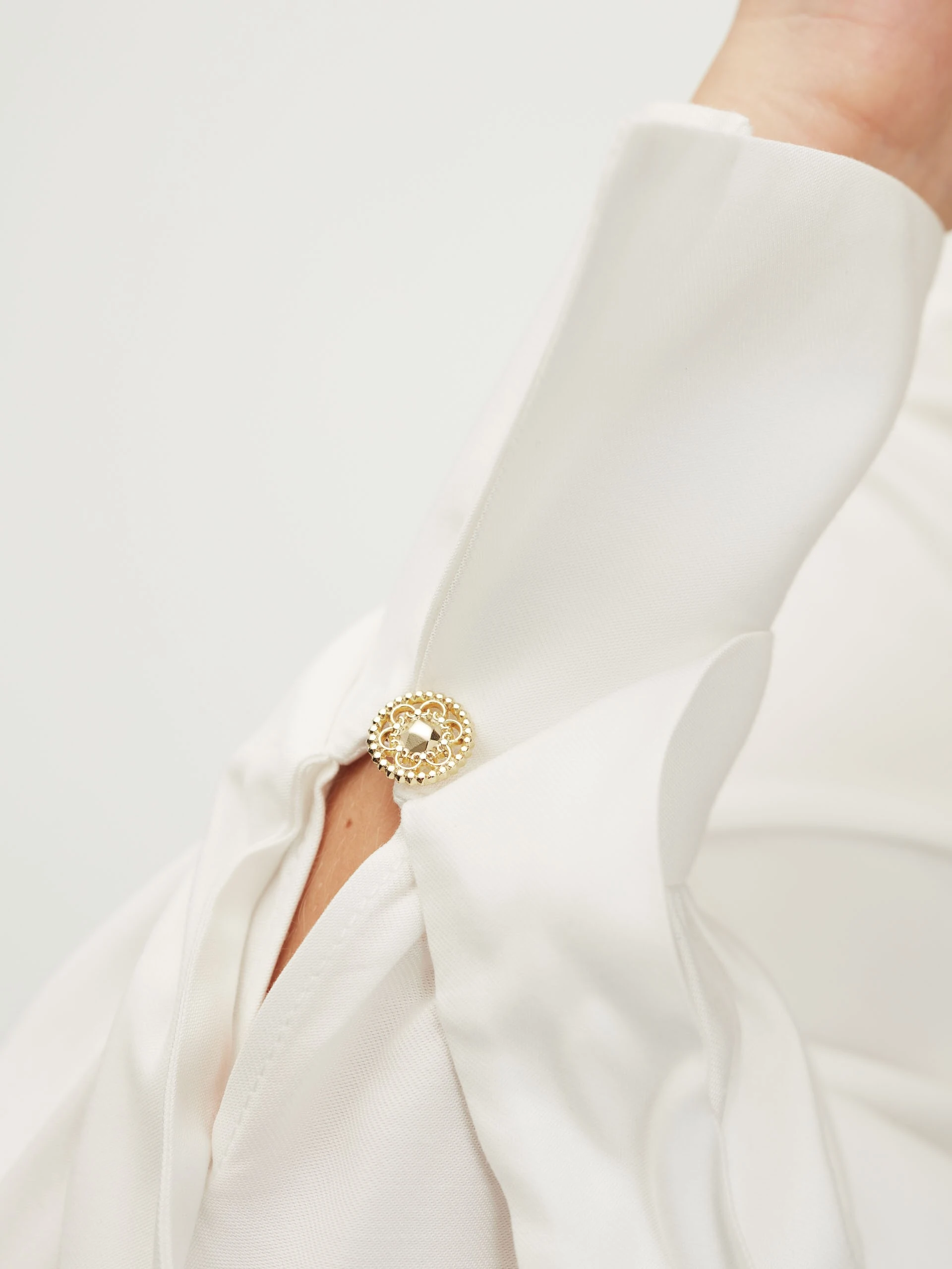 White shirt with jeweled buttons