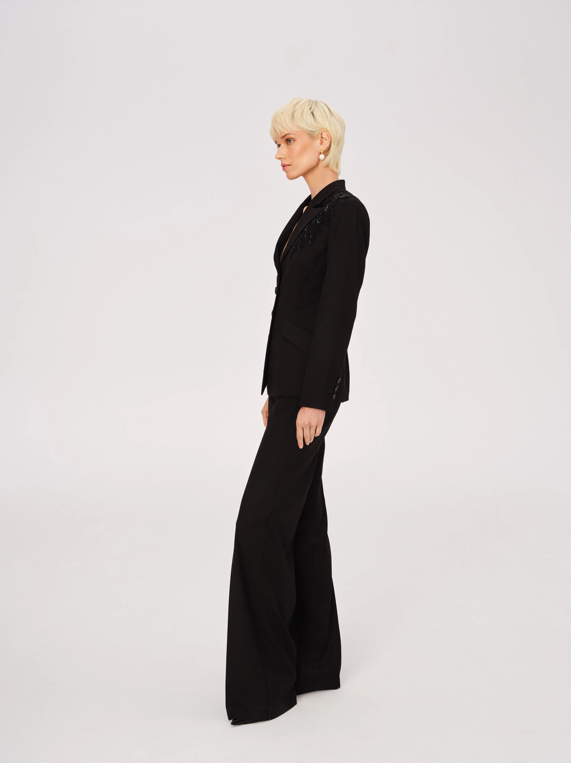 Elegant black pants with jeweled appliqué